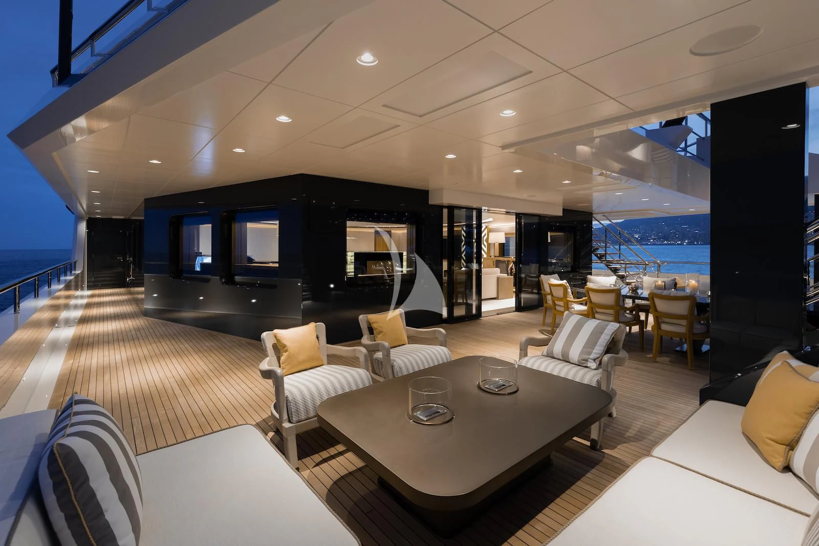 a room with a table chairs and a large window aboard LA DATCHA Yacht for Sale