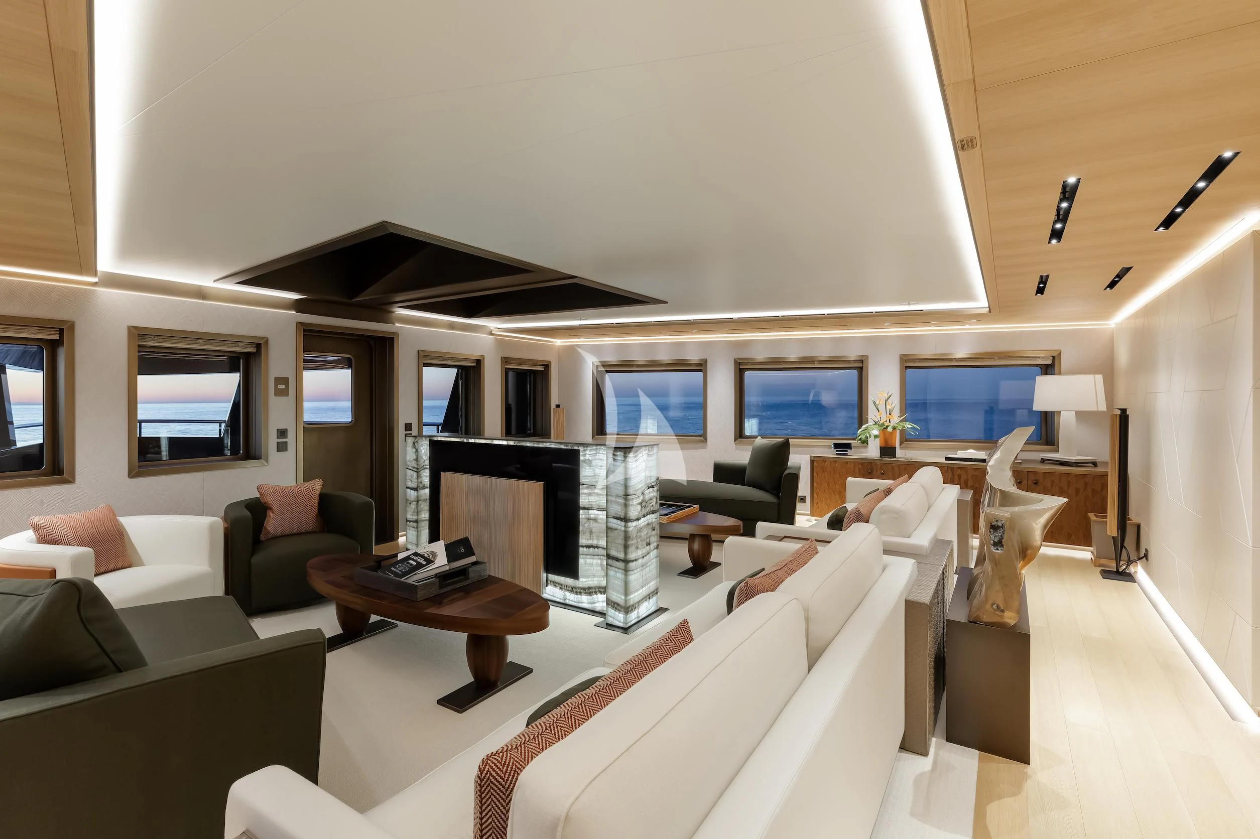 a living room with a fireplace aboard LA DATCHA Yacht for Sale