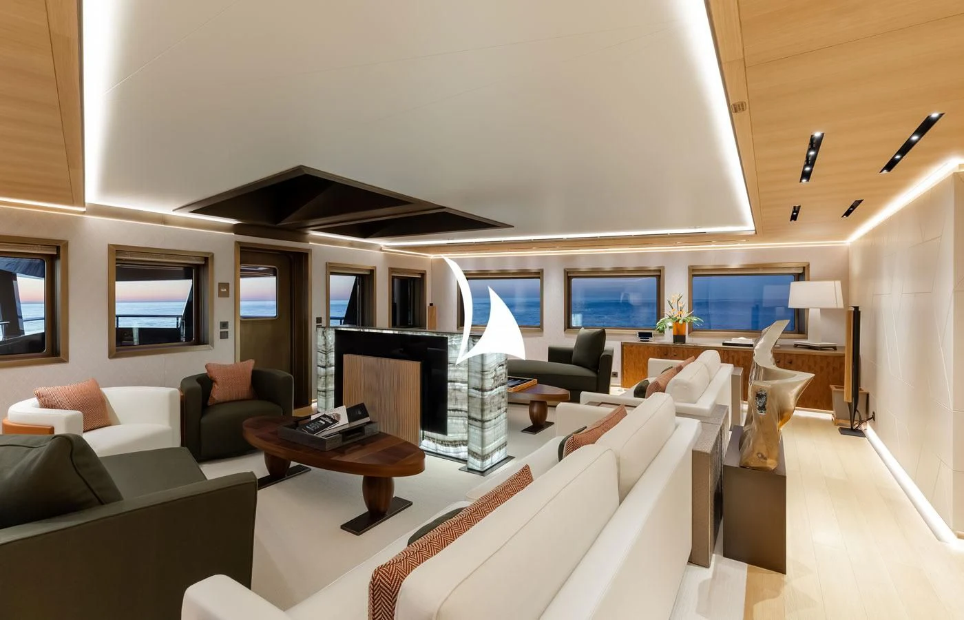 a living room with a couch and a fireplace aboard LA DATCHA Yacht for Sale