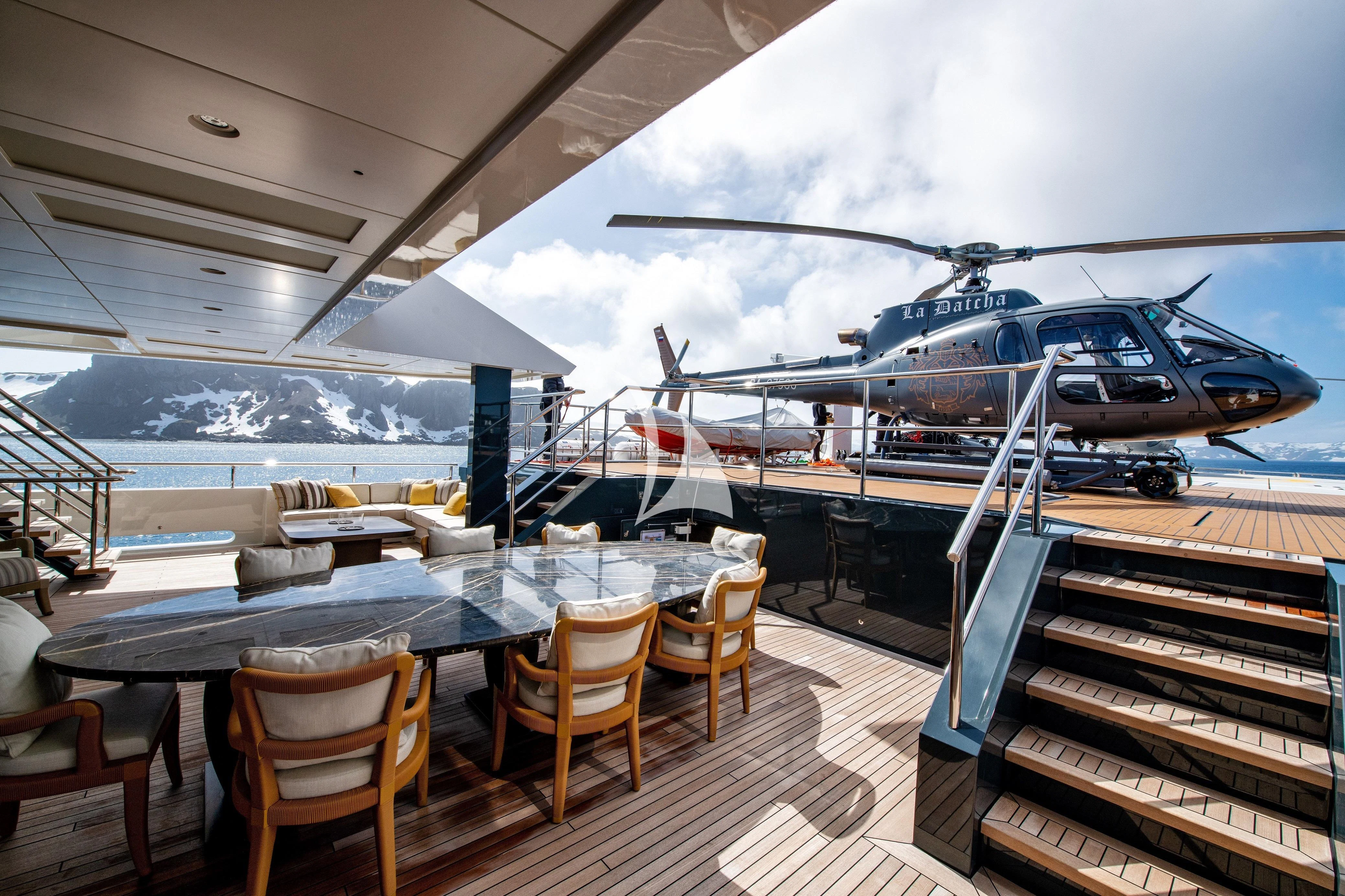 a helicopter on a deck aboard LA DATCHA Yacht for Sale