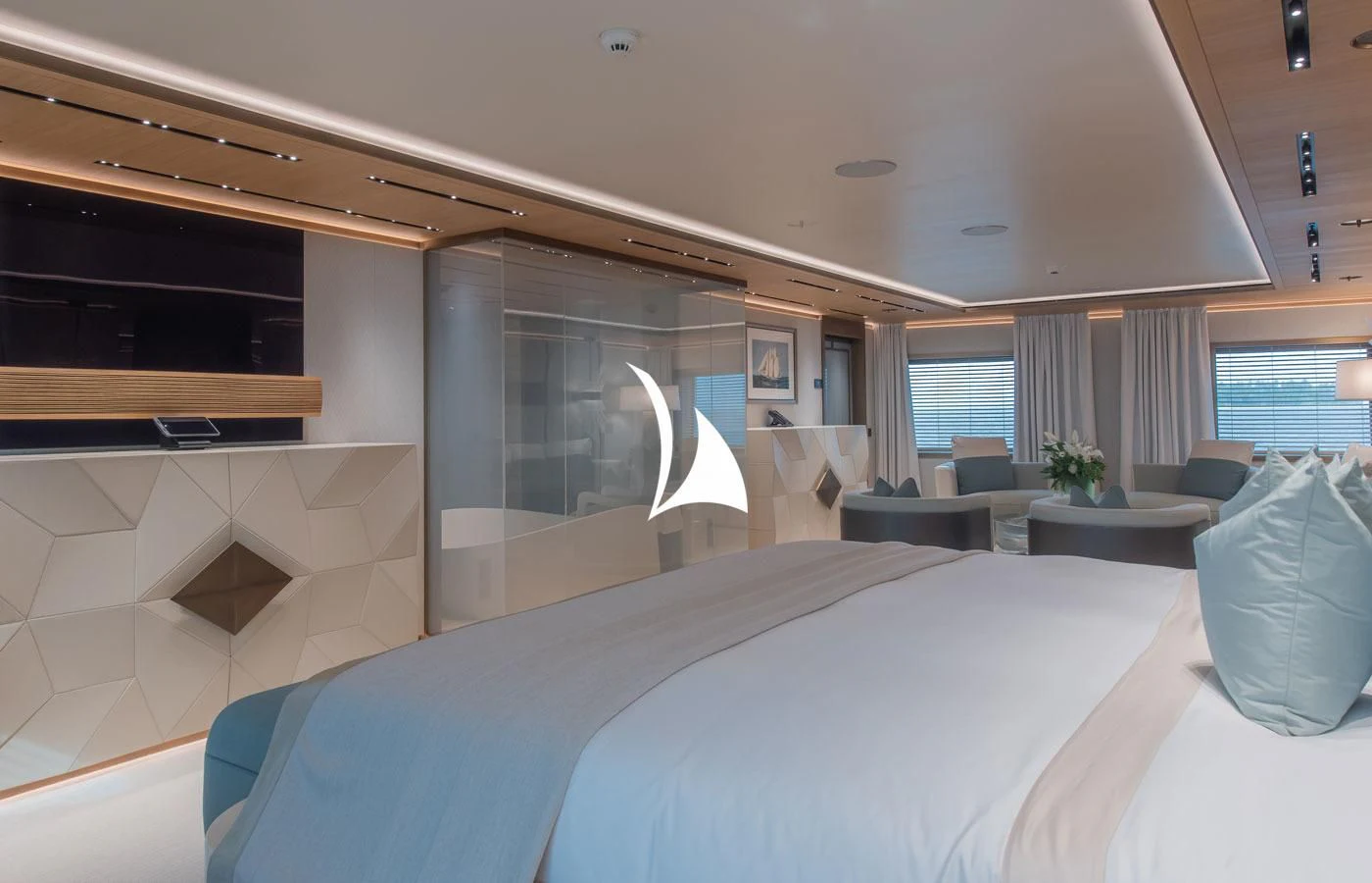 a room with a bed and a table aboard LA DATCHA Yacht for Sale