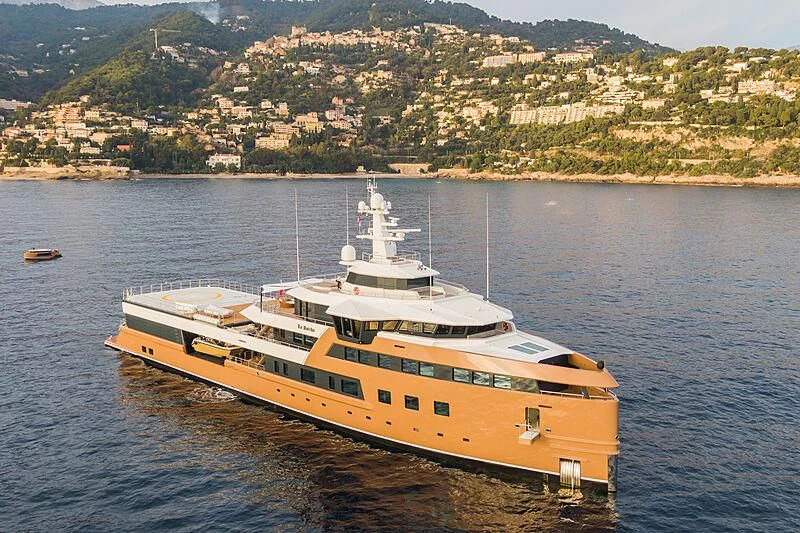 a large yellow boat on water aboard LA DATCHA Yacht for Sale