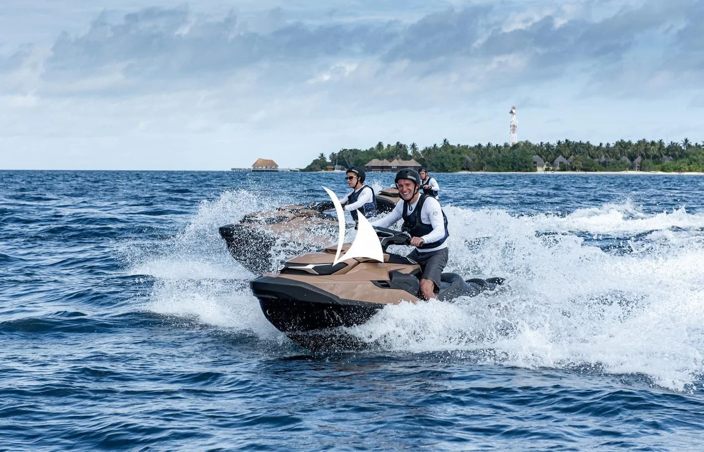 a man and woman on a jet ski aboard LA DATCHA Yacht for Sale