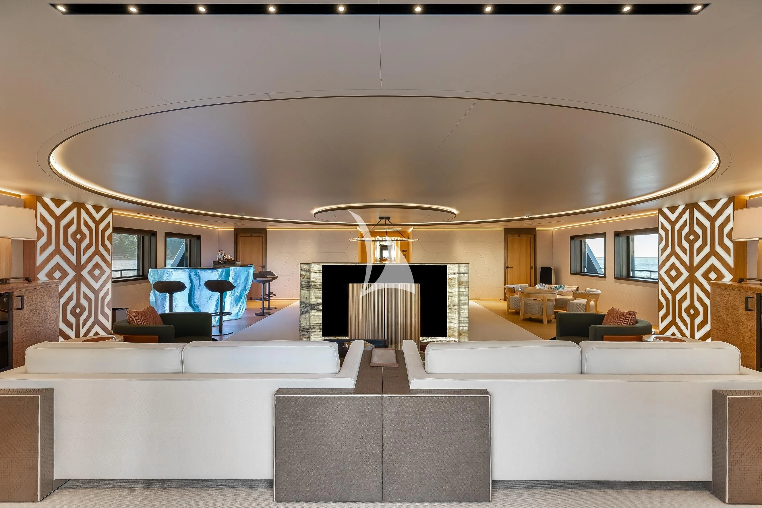 a large living room with a fireplace aboard LA DATCHA Yacht for Sale