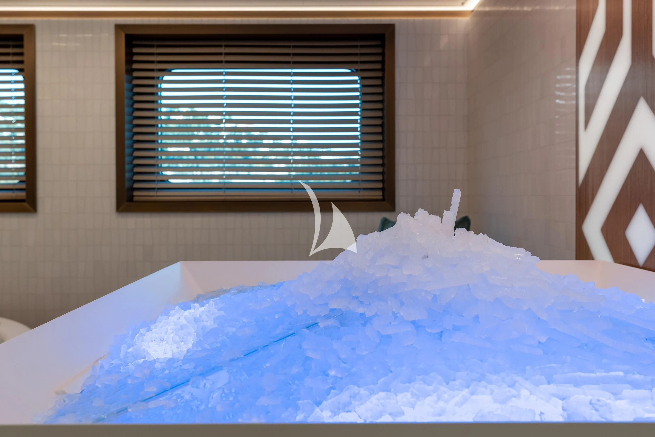 a bed with a blue sheet aboard LA DATCHA Yacht for Sale