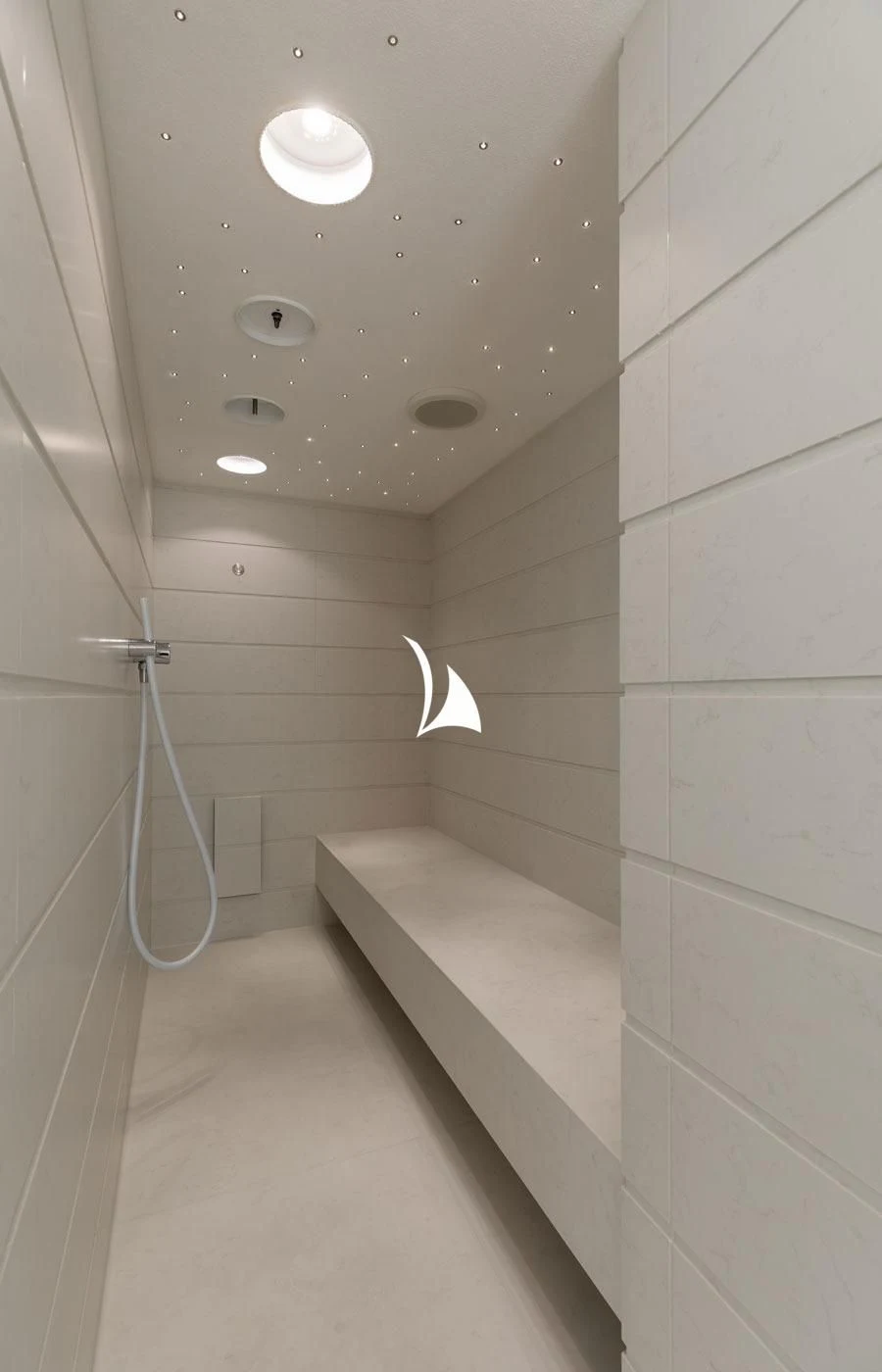 a white tiled bathroom aboard LA DATCHA Yacht for Sale