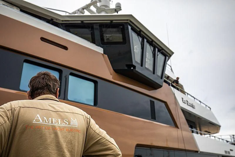 a man standing in front of a train aboard LA DATCHA Yacht for Sale