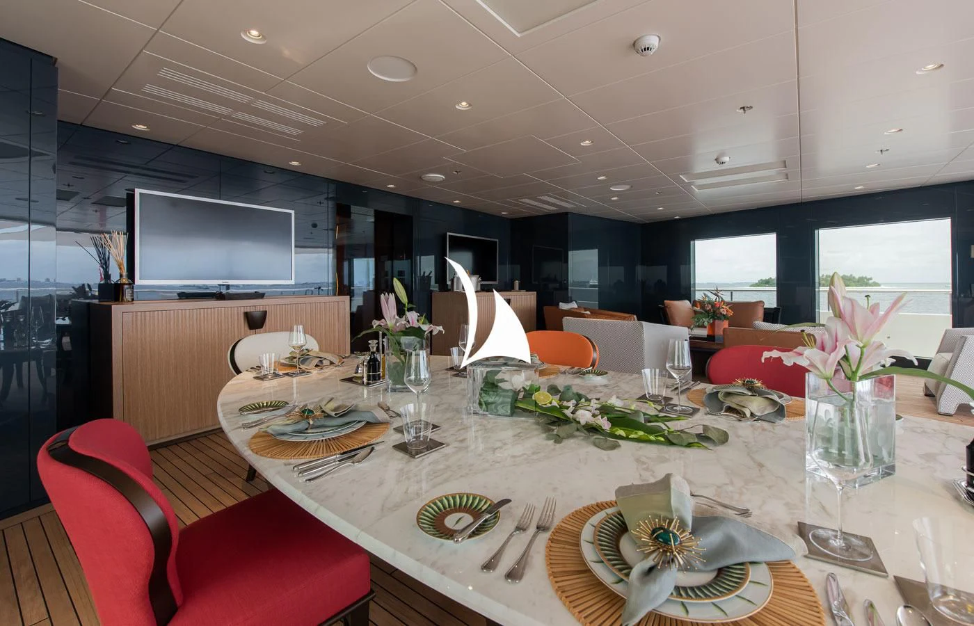 a dining room with a table set aboard LA DATCHA Yacht for Sale
