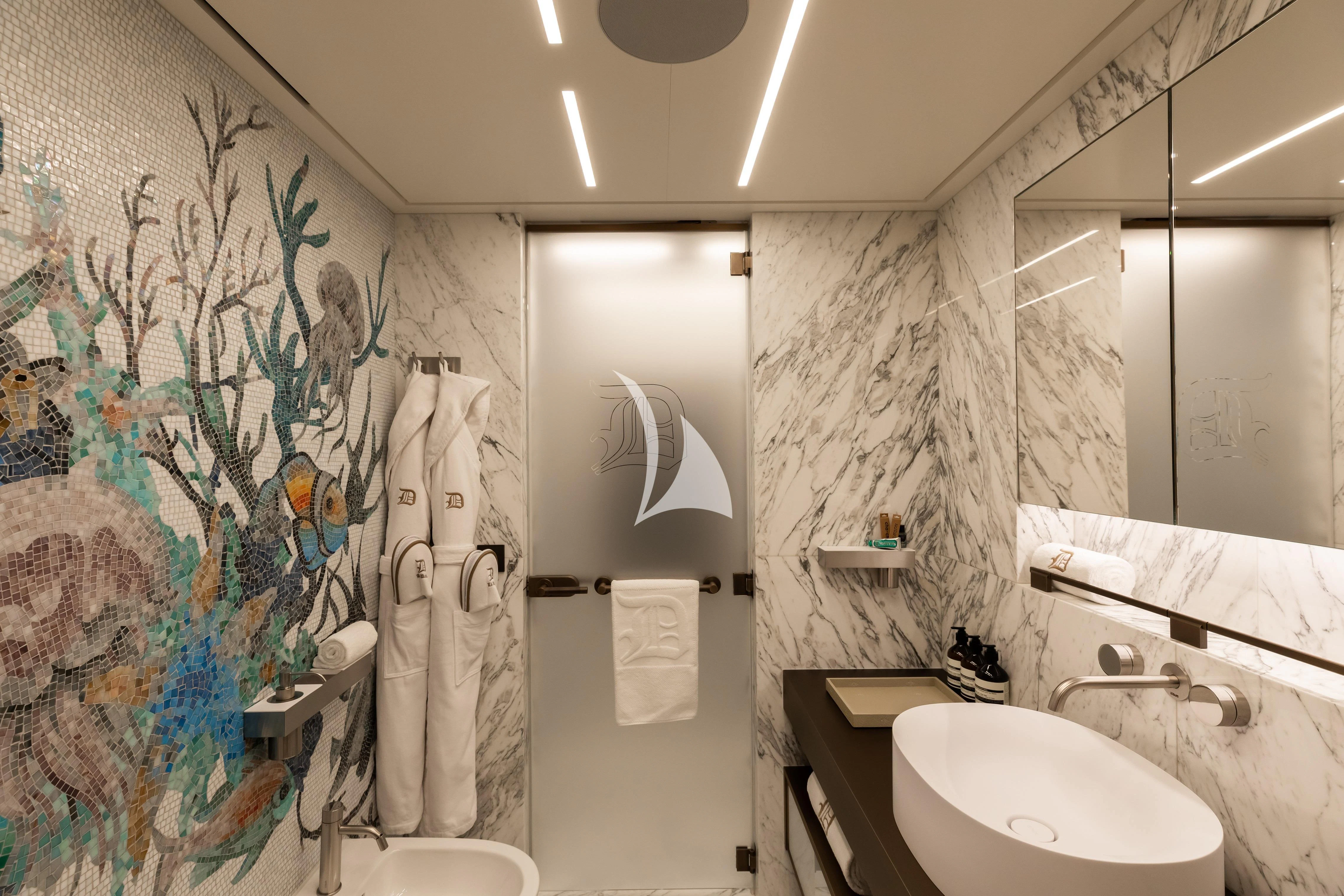 a bathroom with a sink and a mirror aboard LA DATCHA Yacht for Sale
