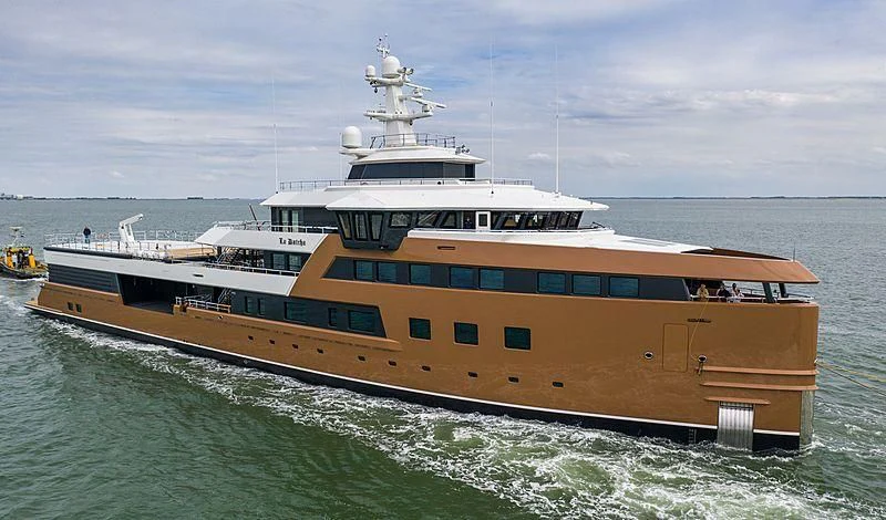 a large white and yellow ship aboard LA DATCHA Yacht for Sale