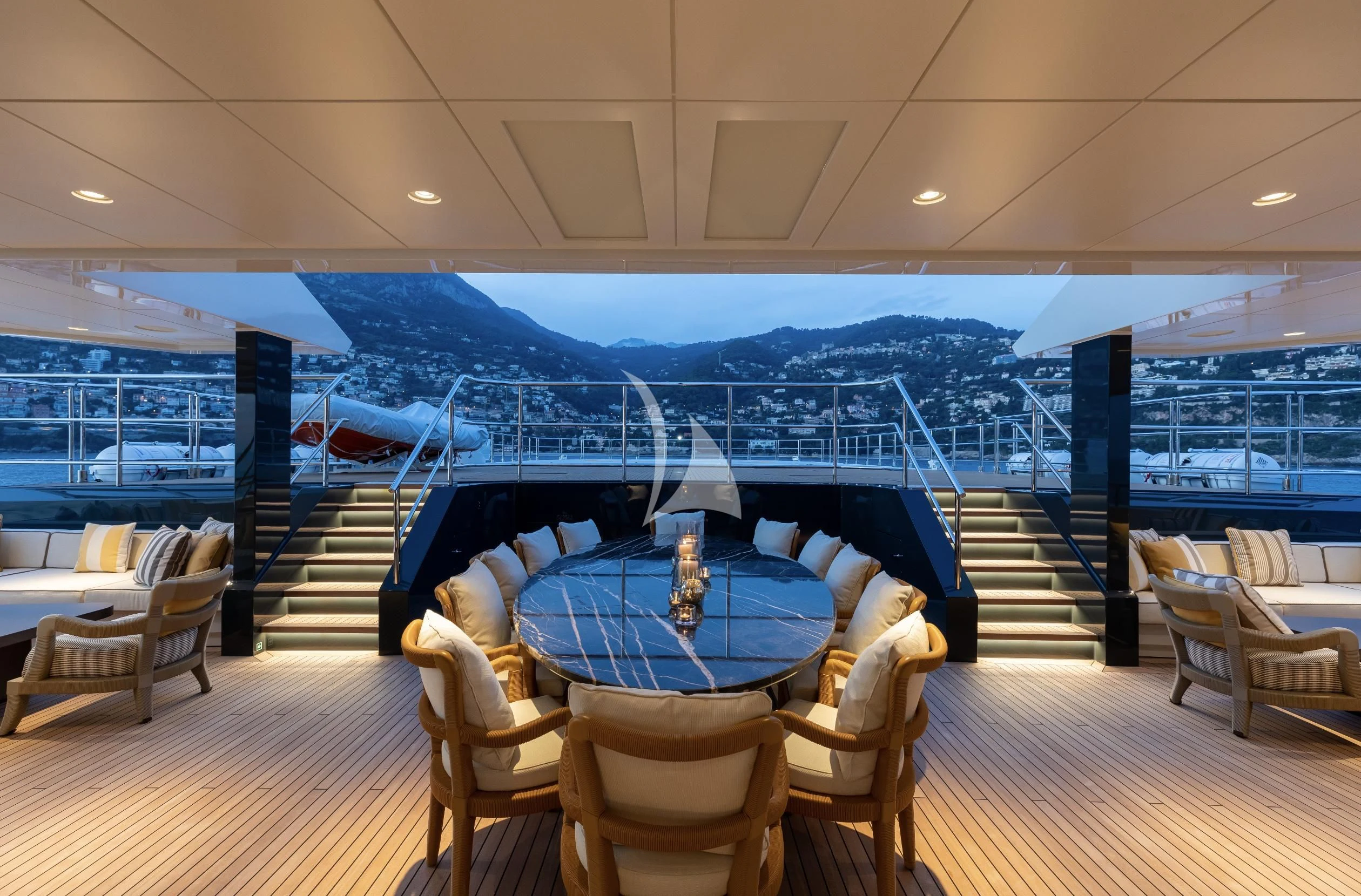 a room with a table and chairs aboard LA DATCHA Yacht for Sale