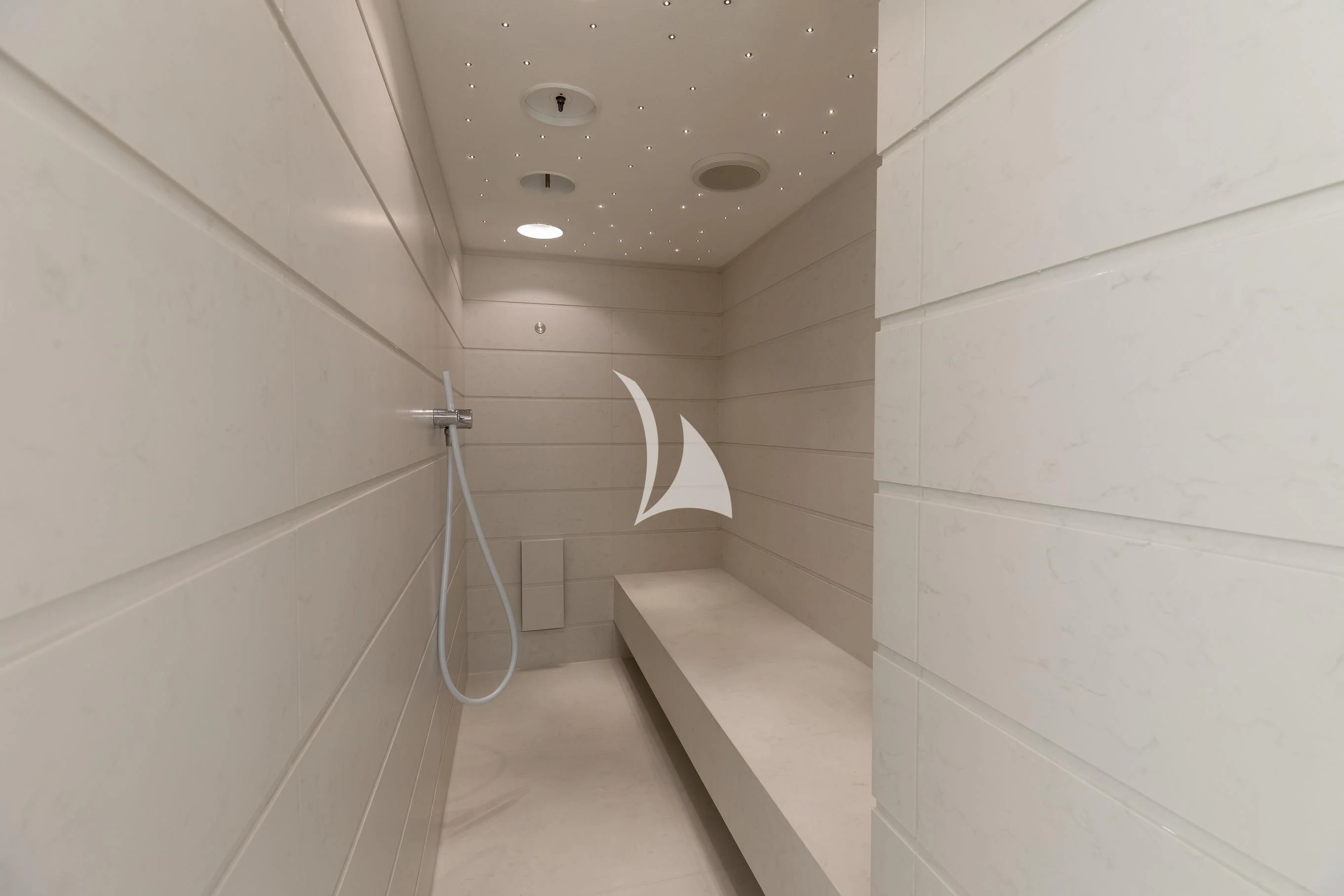 a white tile bathroom aboard LA DATCHA Yacht for Sale