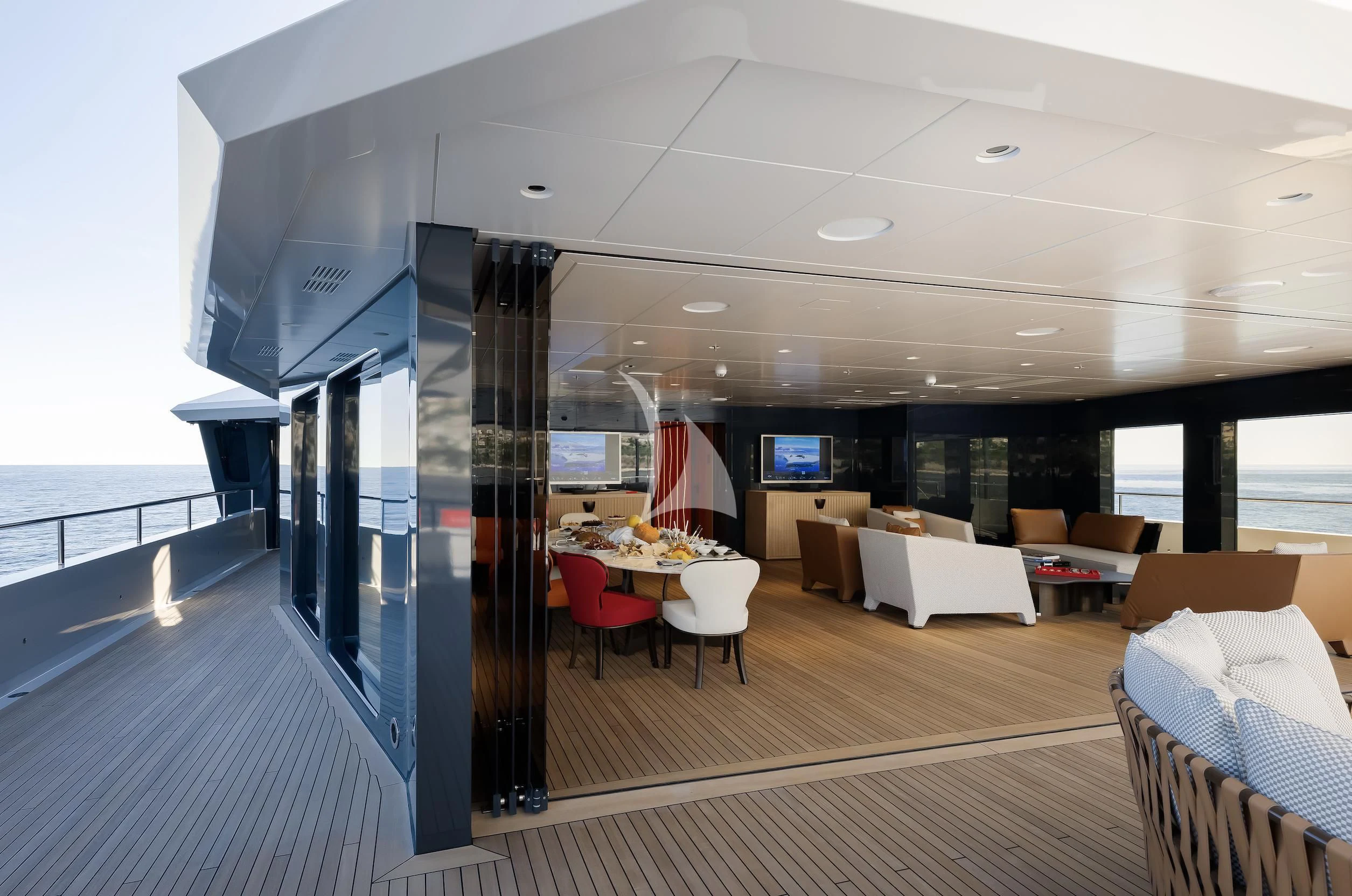 a room with a large window and a view of the ocean aboard LA DATCHA Yacht for Sale