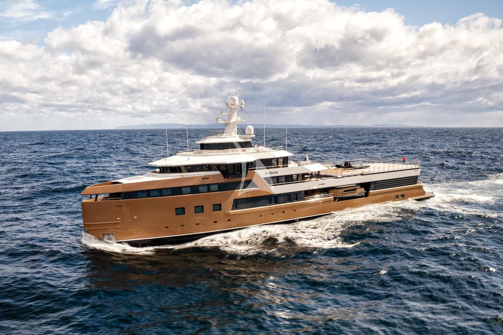 a large ship in the water aboard LA DATCHA Yacht for Sale