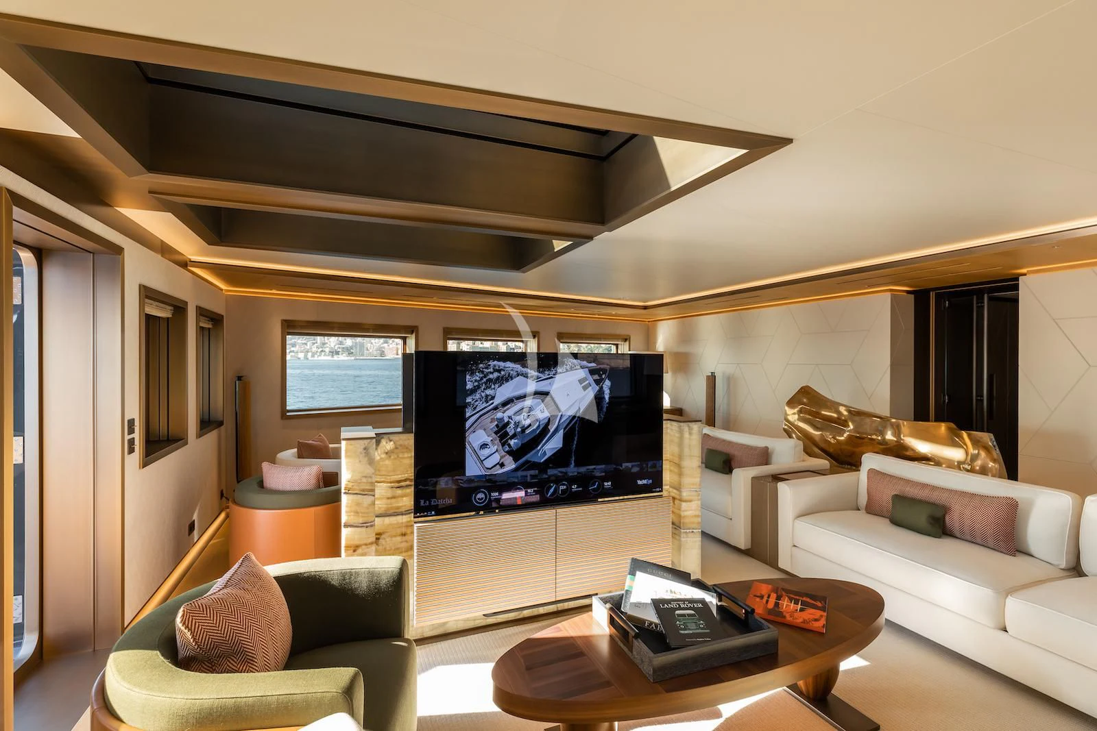 a living room with a large screen aboard LA DATCHA Yacht for Sale