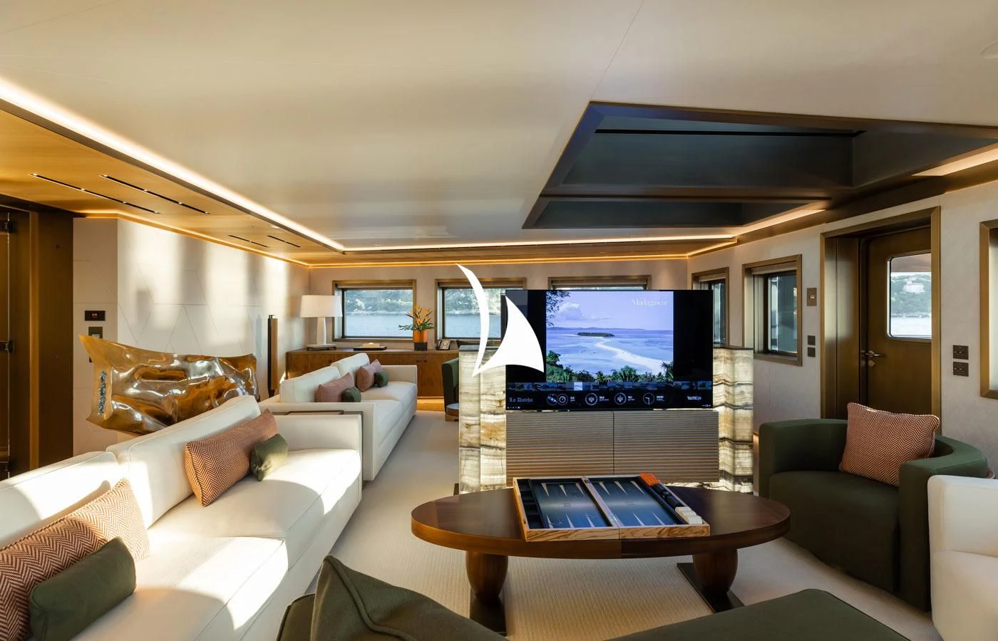 a living room with a large screen aboard LA DATCHA Yacht for Sale