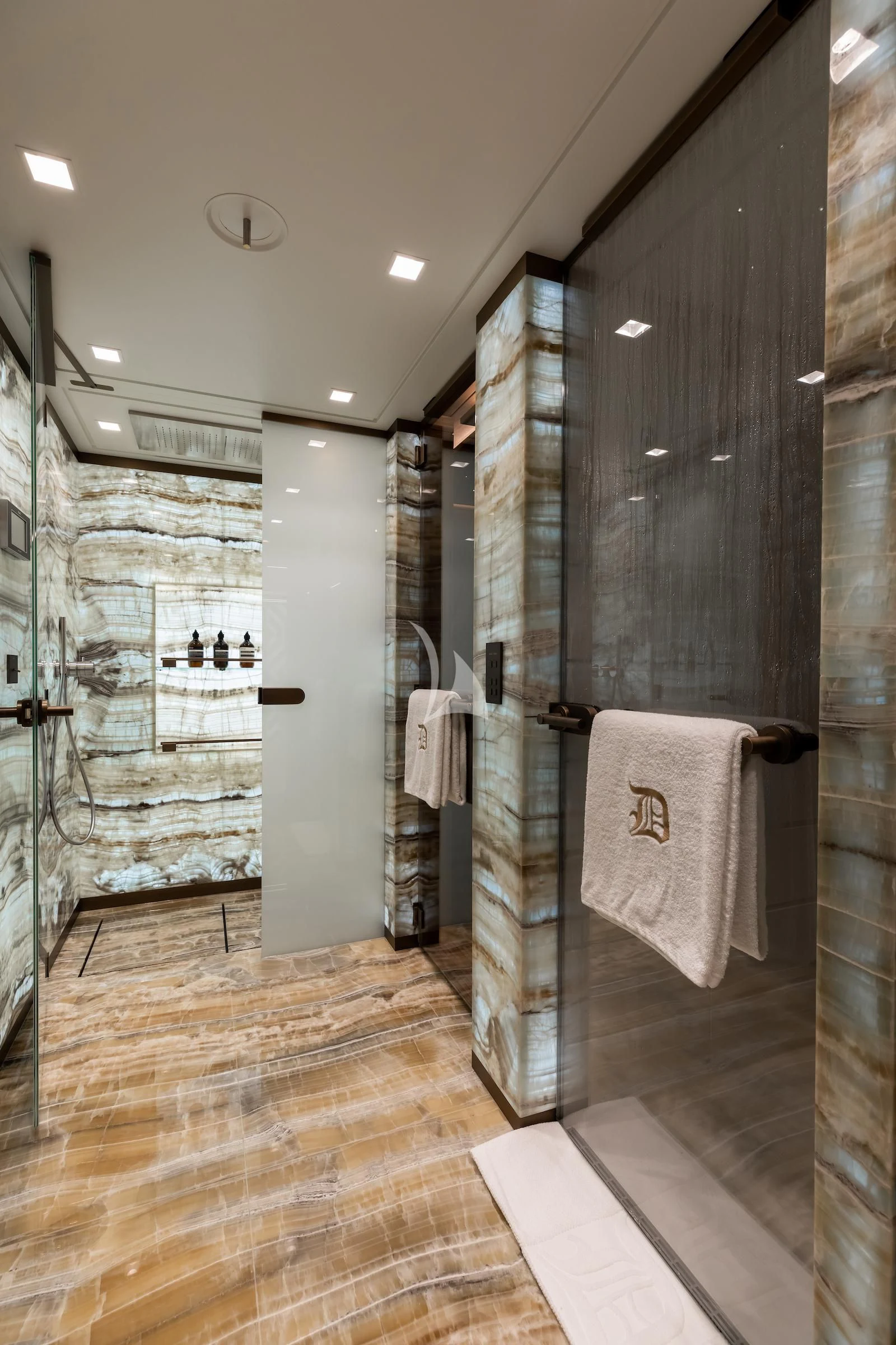 a bathroom with a glass shower aboard LA DATCHA Yacht for Sale