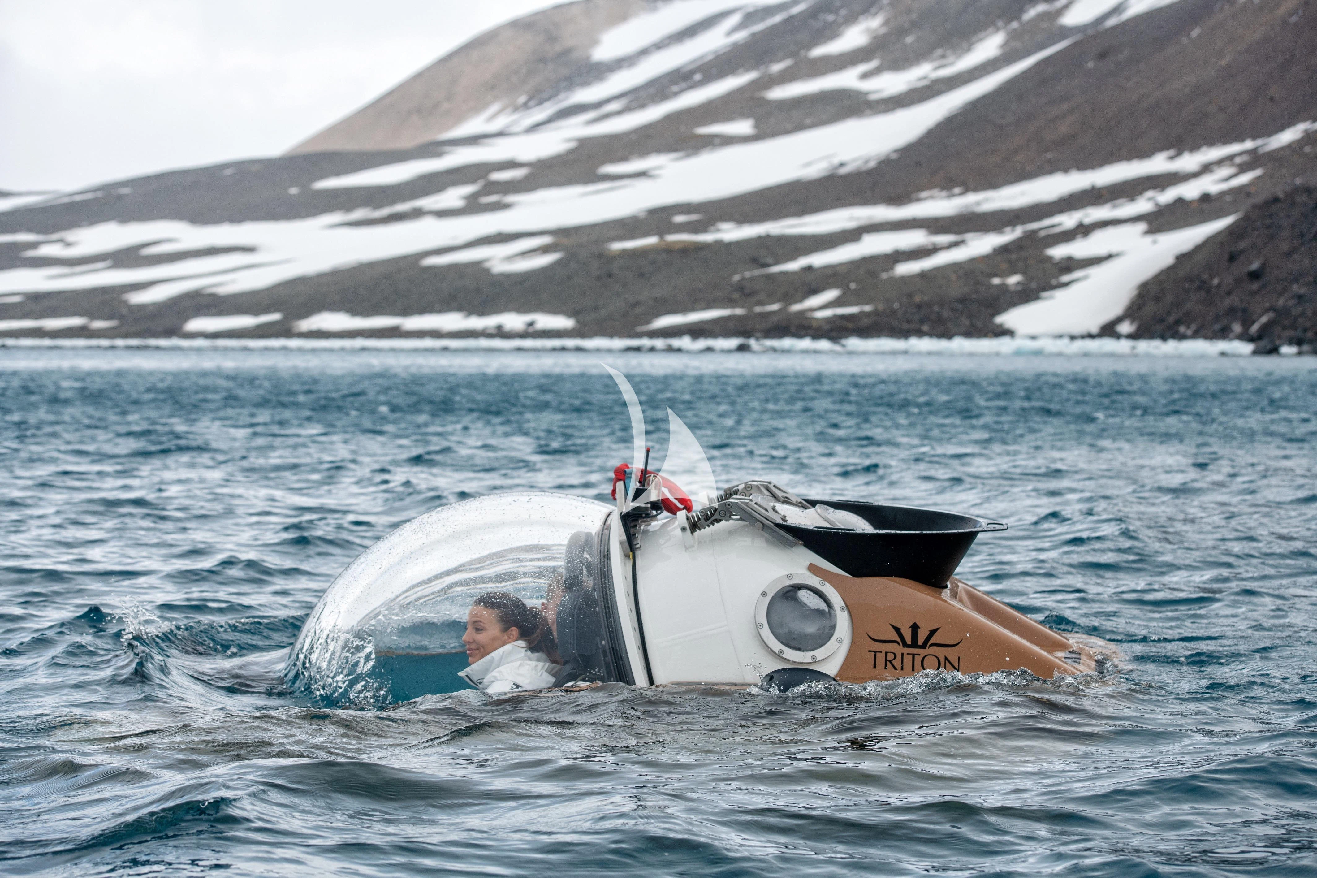 a person driving a white boat in the water aboard LA DATCHA Yacht for Sale