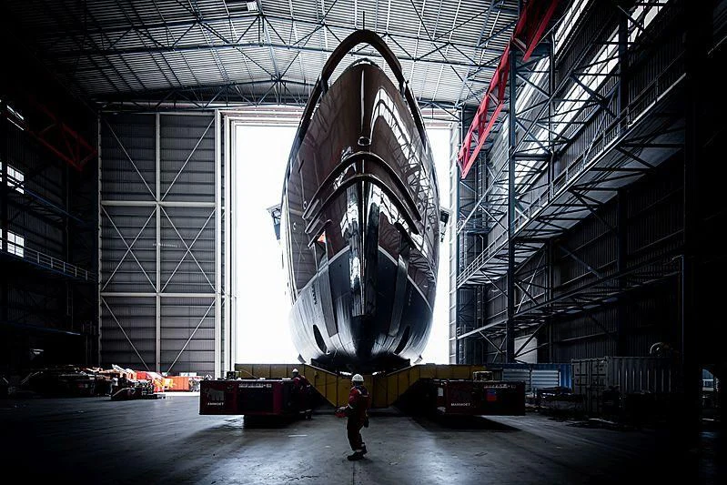 a large space shuttle in a warehouse aboard LA DATCHA Yacht for Sale