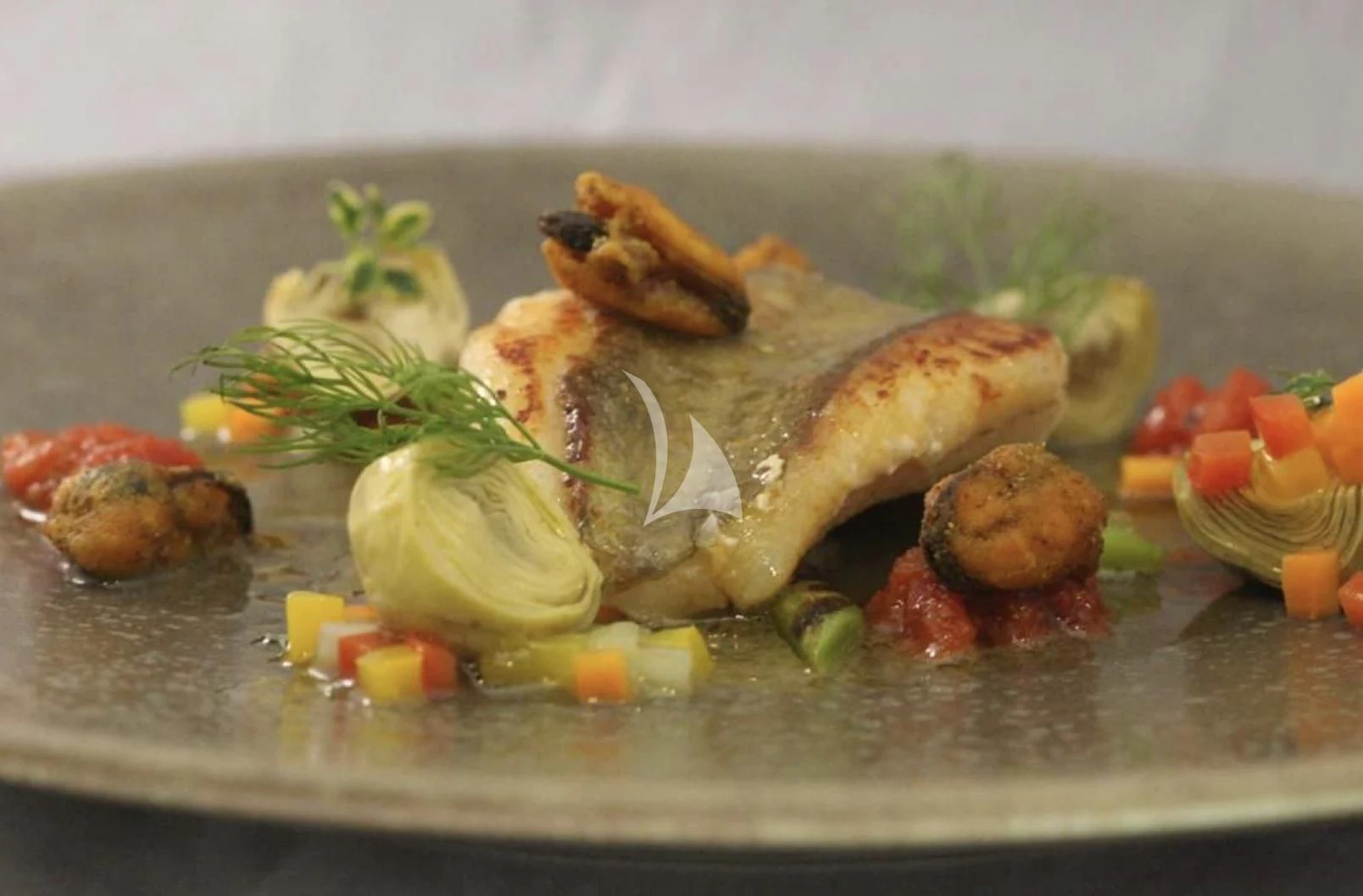 a plate of food aboard LA DATCHA Yacht for Sale