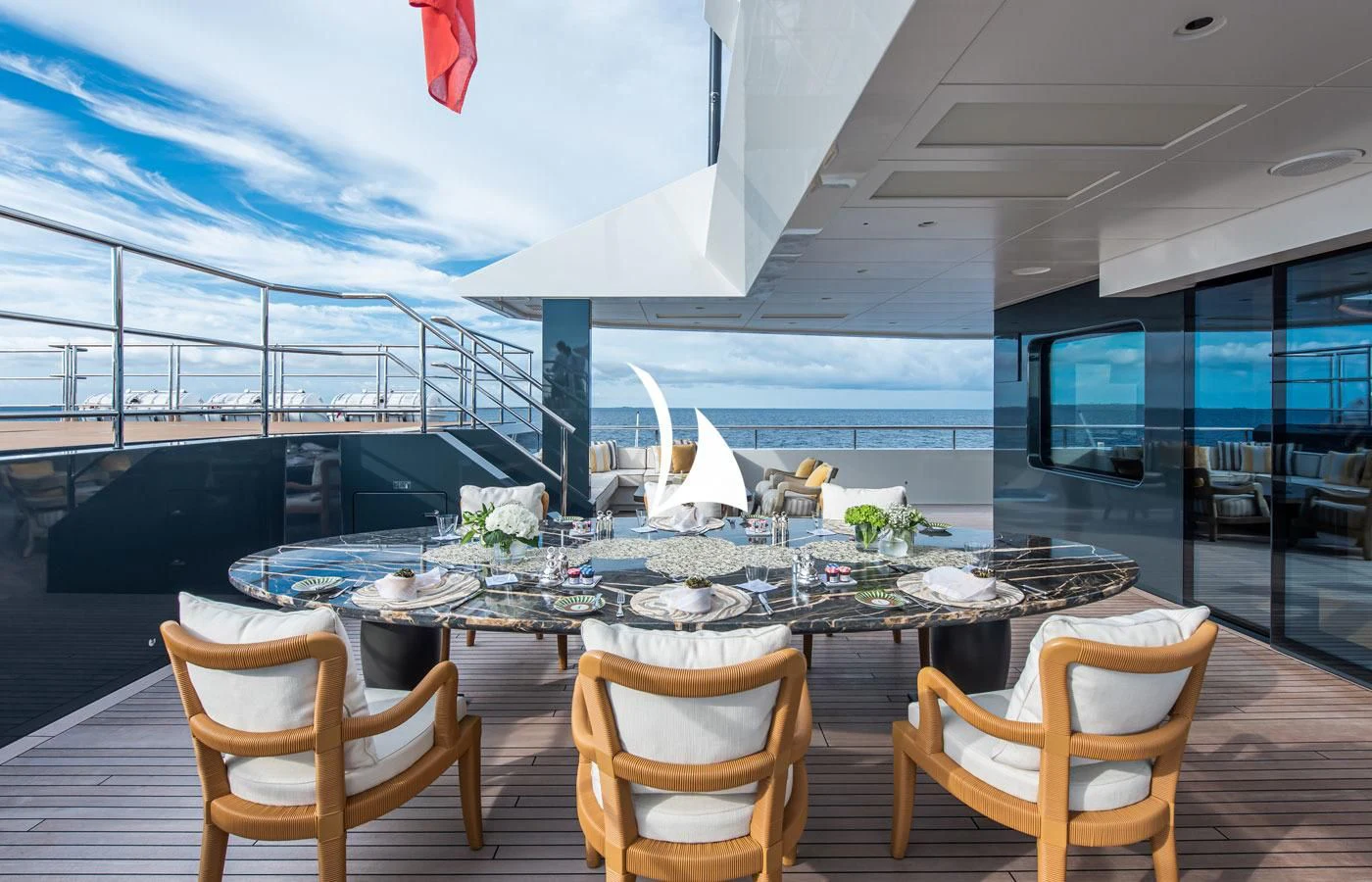 a room with a table and chairs aboard LA DATCHA Yacht for Sale
