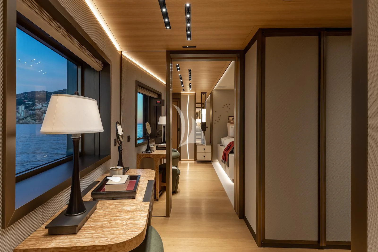 a room with a table and a lamp aboard LA DATCHA Yacht for Sale