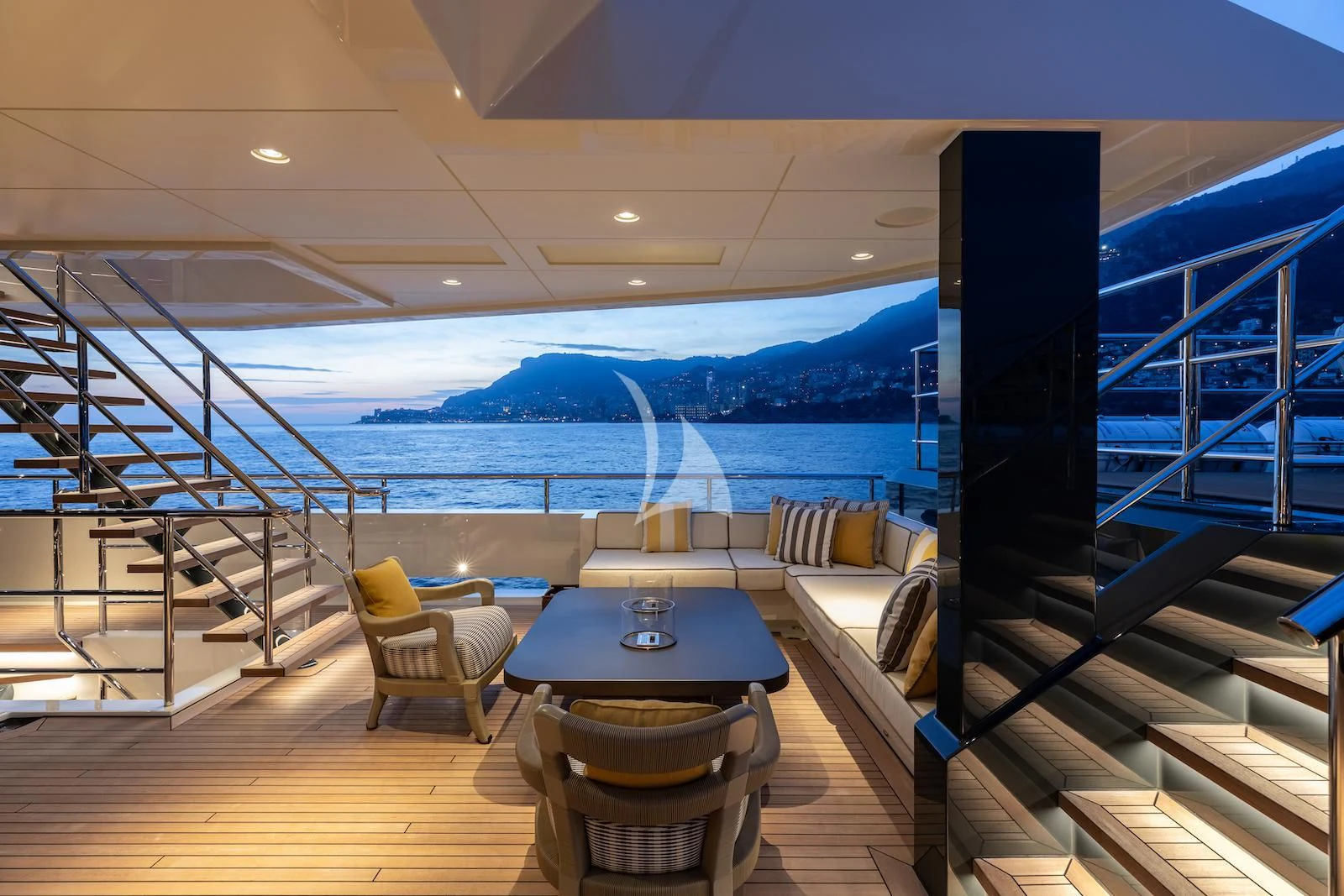 a room with a table and chairs aboard LA DATCHA Yacht for Sale