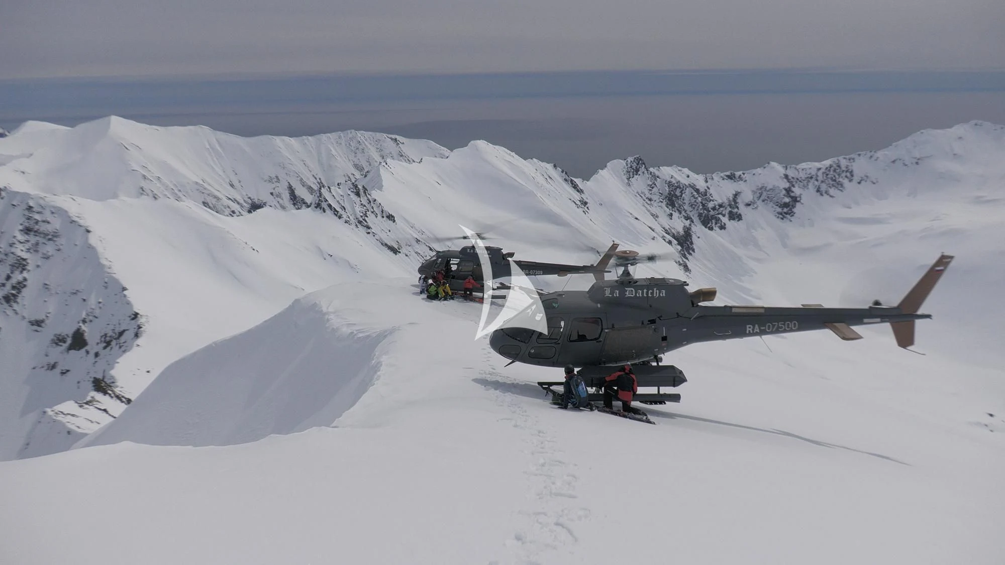 a helicopter on a snowy mountain aboard LA DATCHA Yacht for Sale