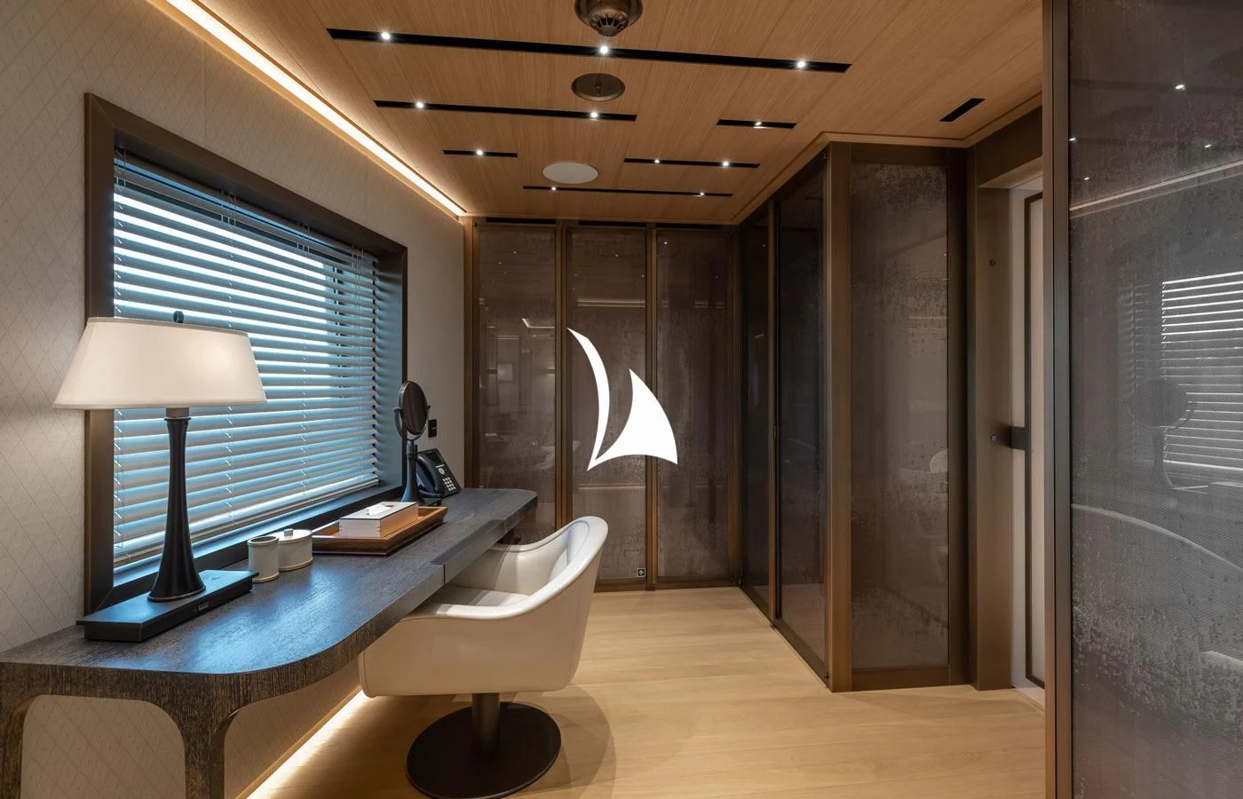 a room with a desk and a chair aboard LA DATCHA Yacht for Sale