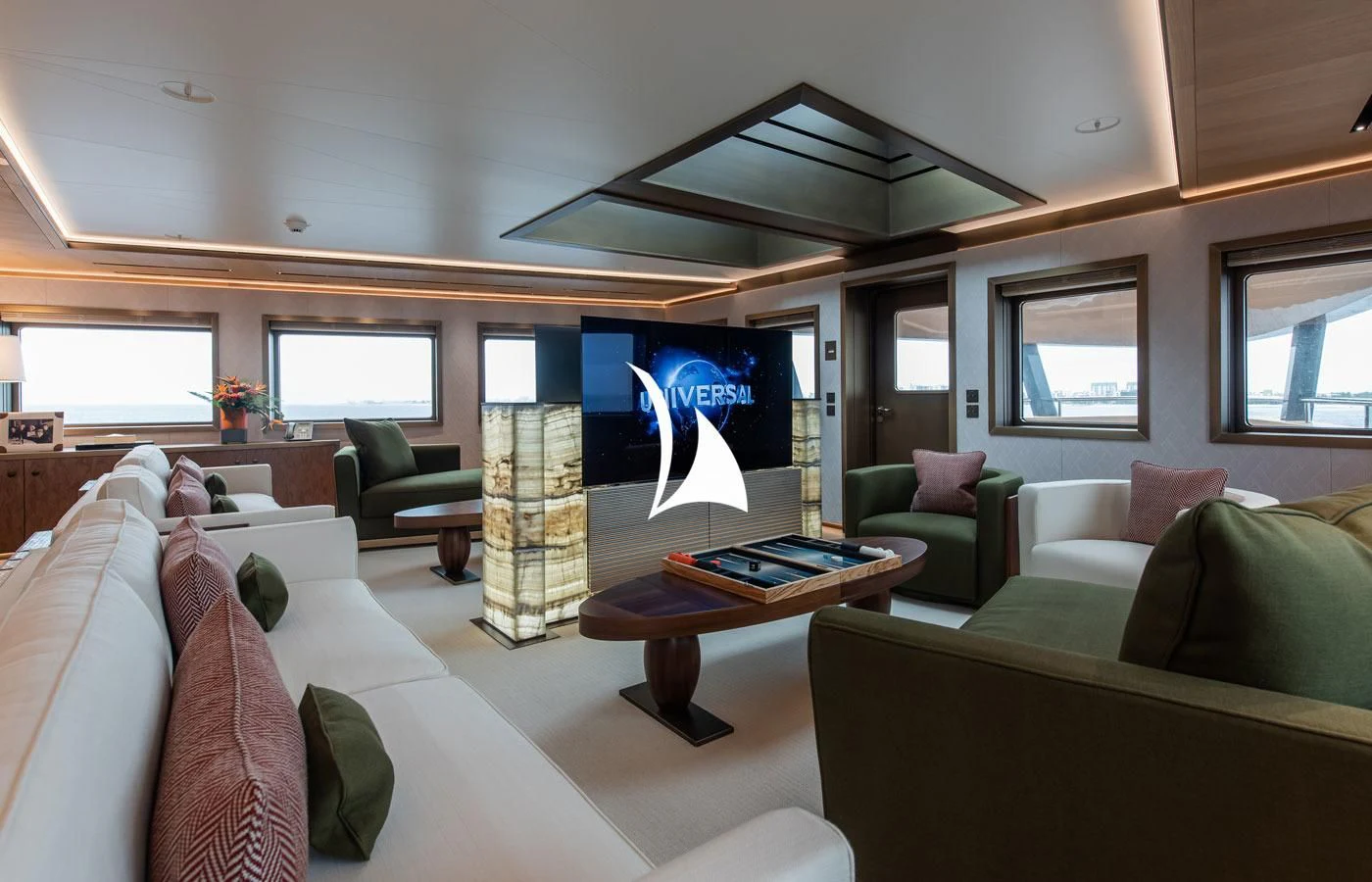 a living room with a large screen aboard LA DATCHA Yacht for Sale