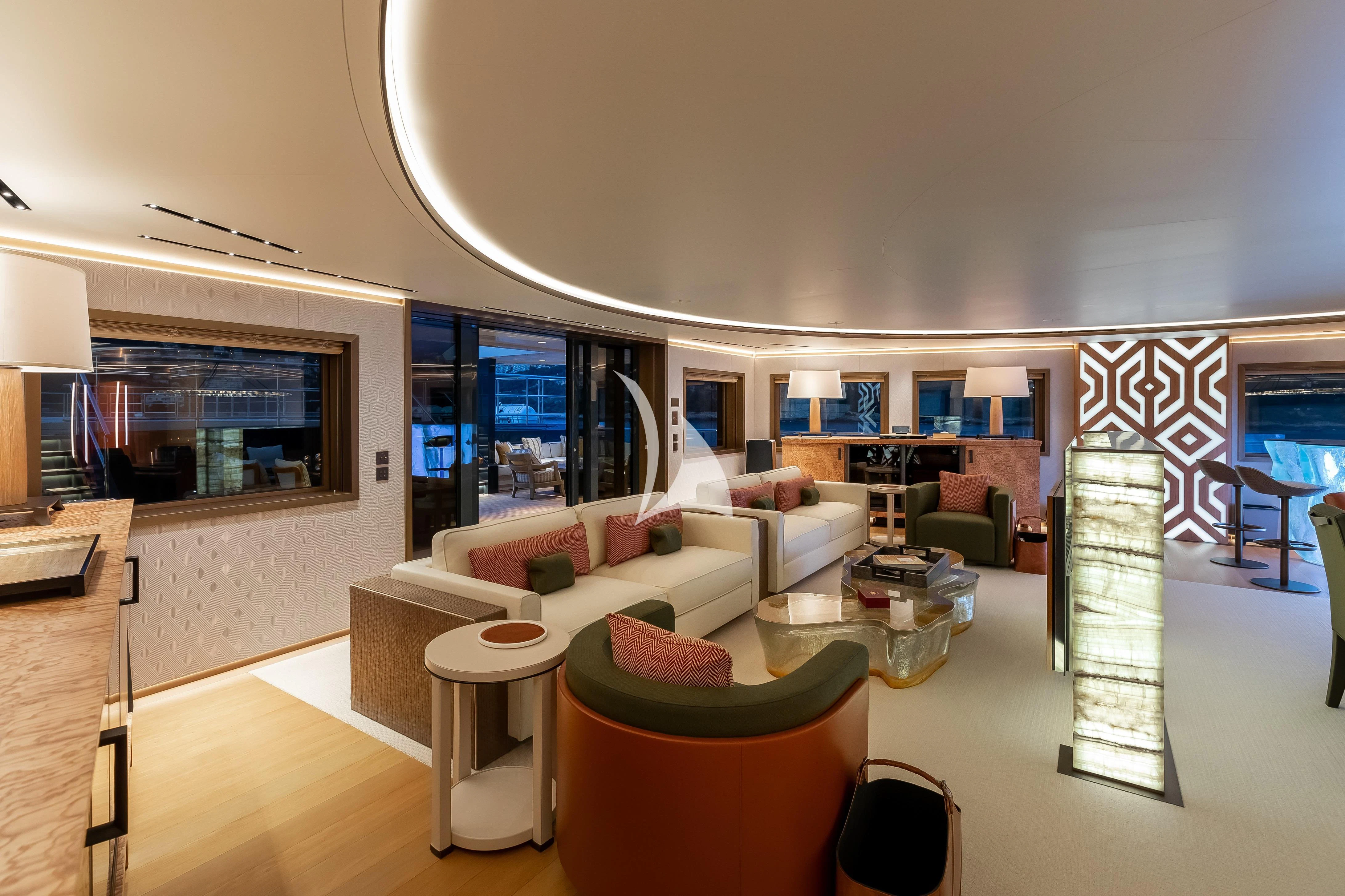 a room with a couch and a table aboard LA DATCHA Yacht for Sale