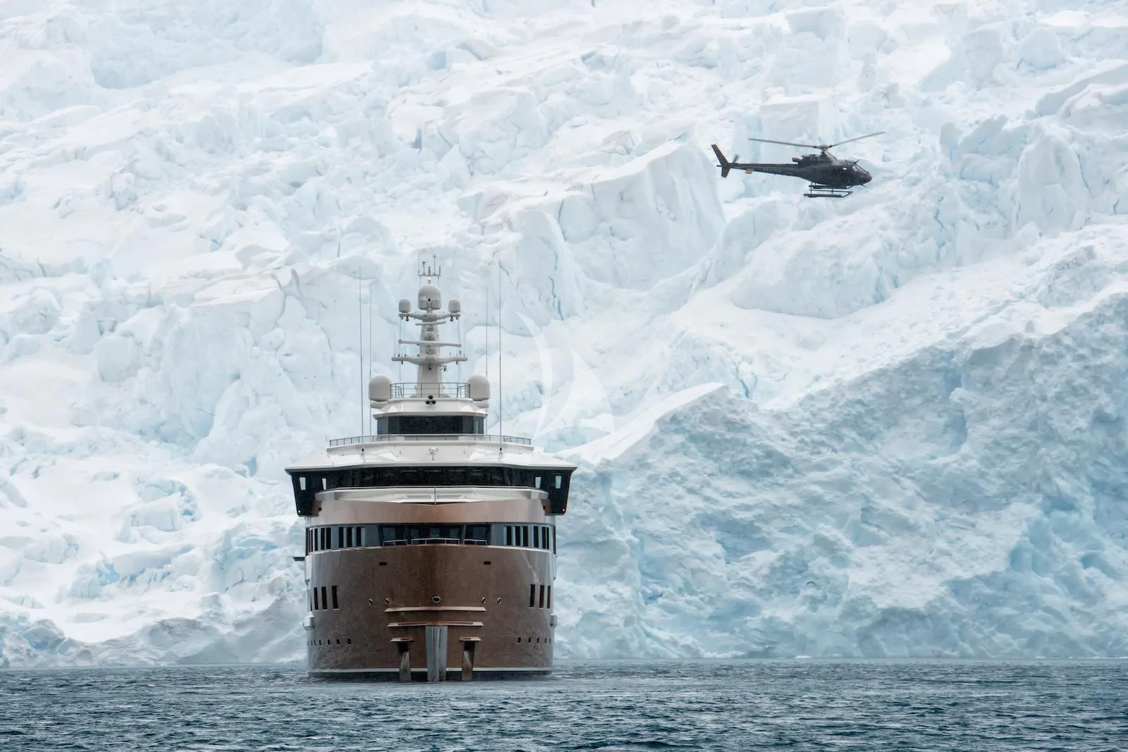 a helicopter flying over a lighthouse aboard LA DATCHA Yacht for Sale