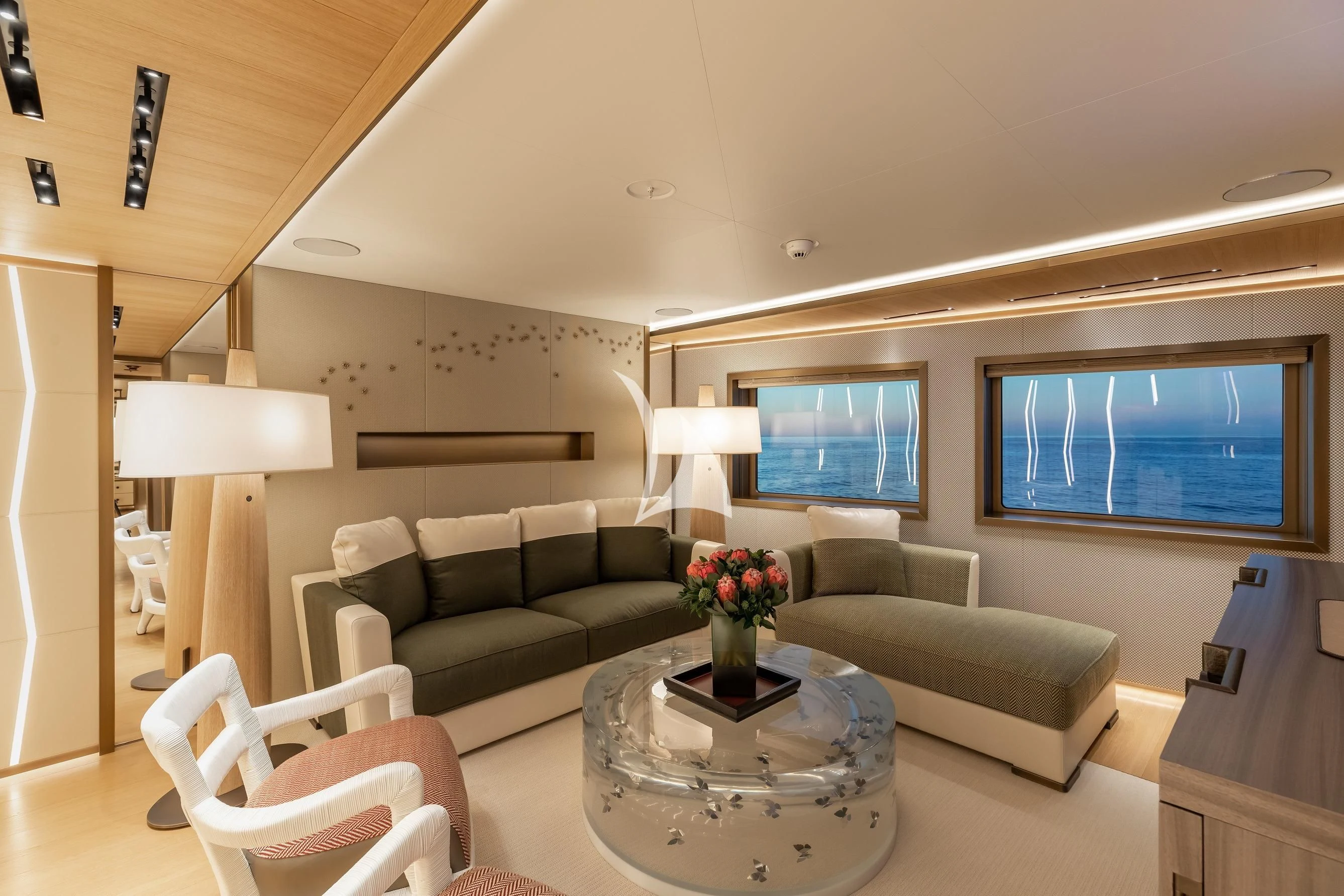 a living room with a couch and a table aboard LA DATCHA Yacht for Sale