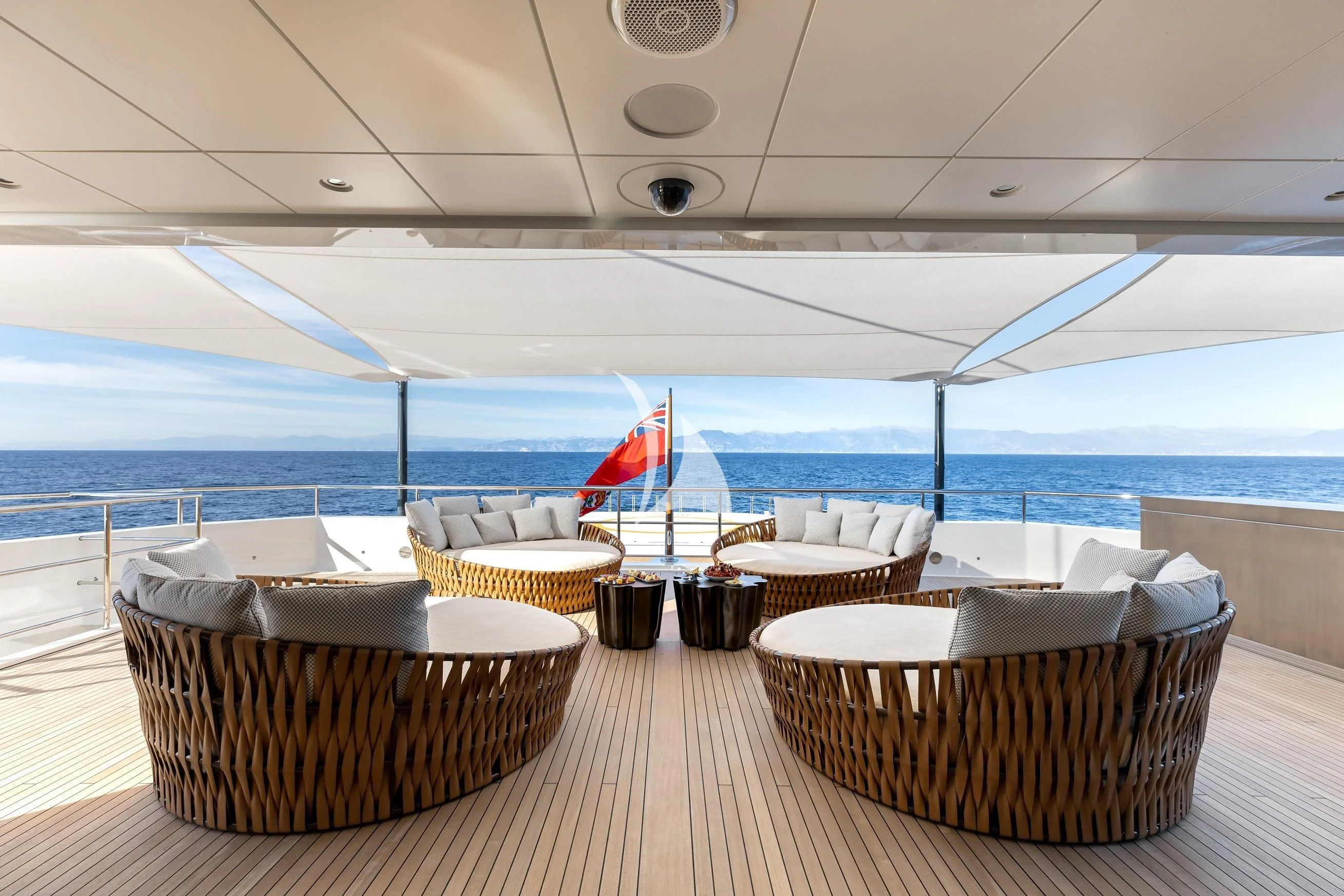 a room with a table and chairs aboard LA DATCHA Yacht for Sale