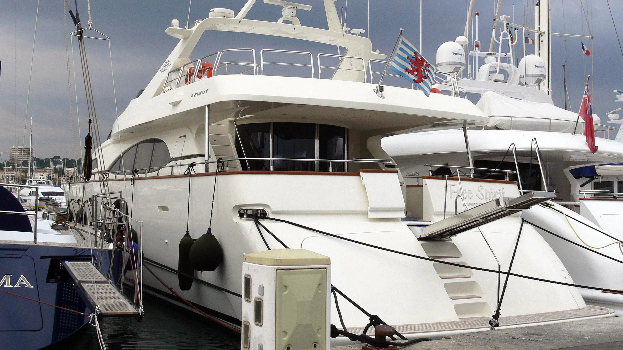 a white boat docked aboard REFLECTION Yacht for Sale