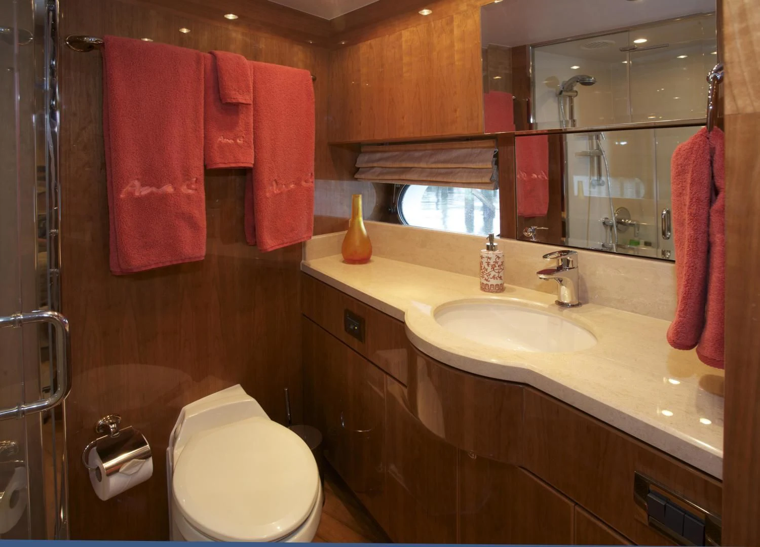 a bathroom with a toilet and a sink aboard LADY C II Yacht for Sale