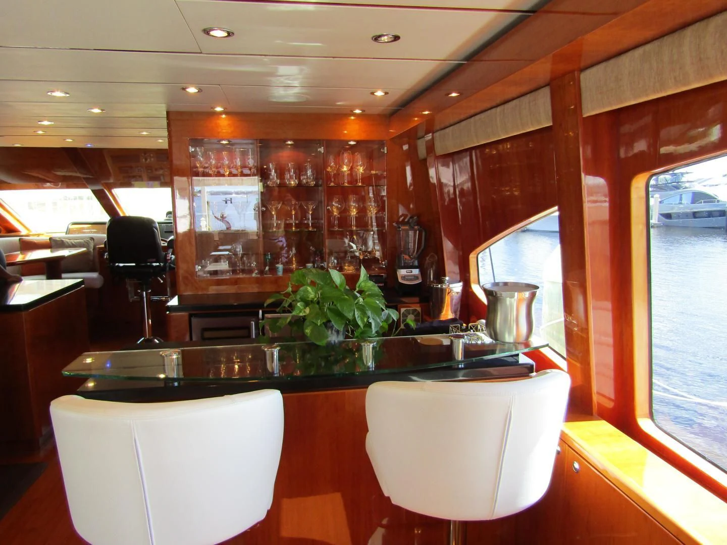 a restaurant with a table and chairs aboard LADY C II Yacht for Sale