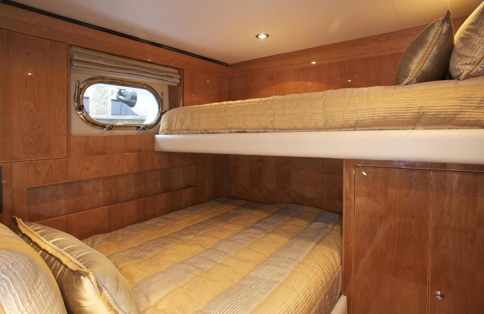 a bed with a mirror above it aboard LADY C II Yacht for Sale
