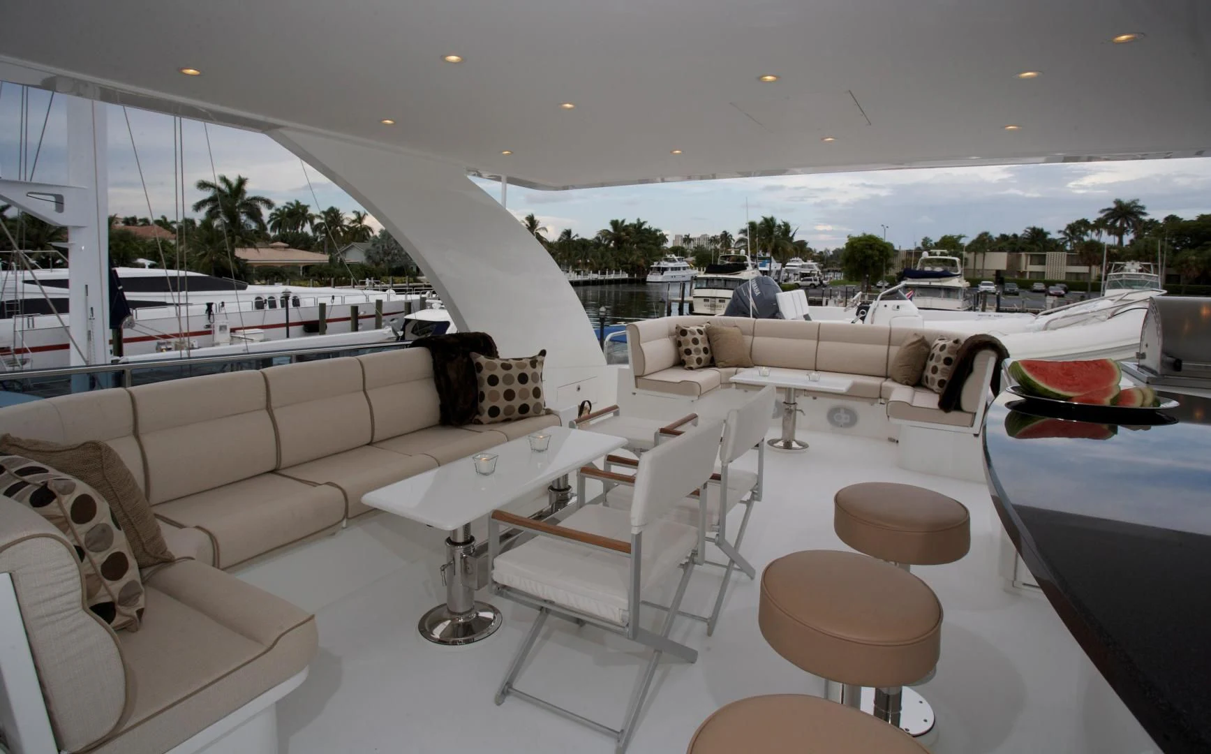 a room with a couch and a table and chairs aboard LADY C II Yacht for Sale