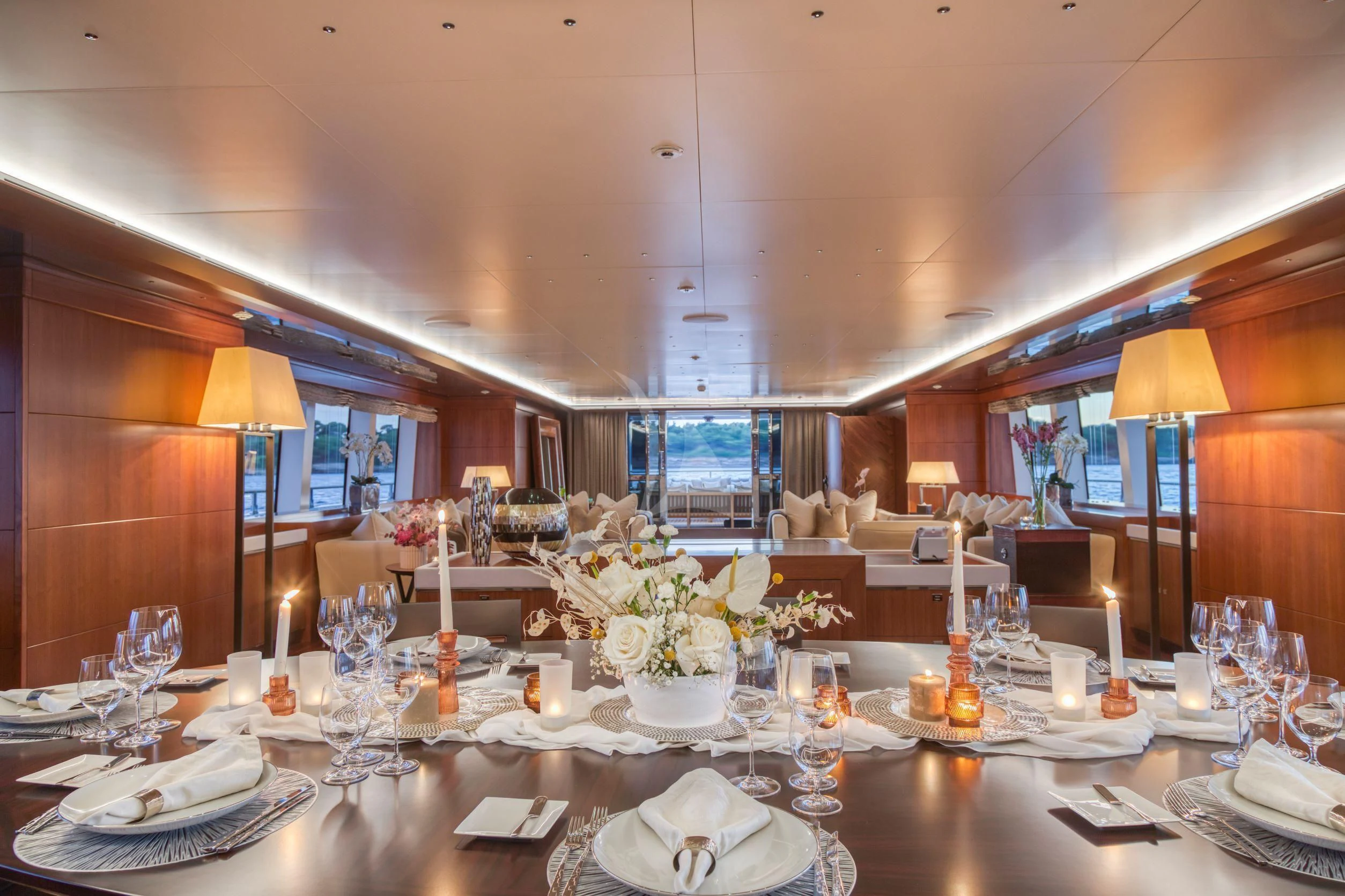 a table set with plates and glasses aboard MARAYA Yacht for Sale