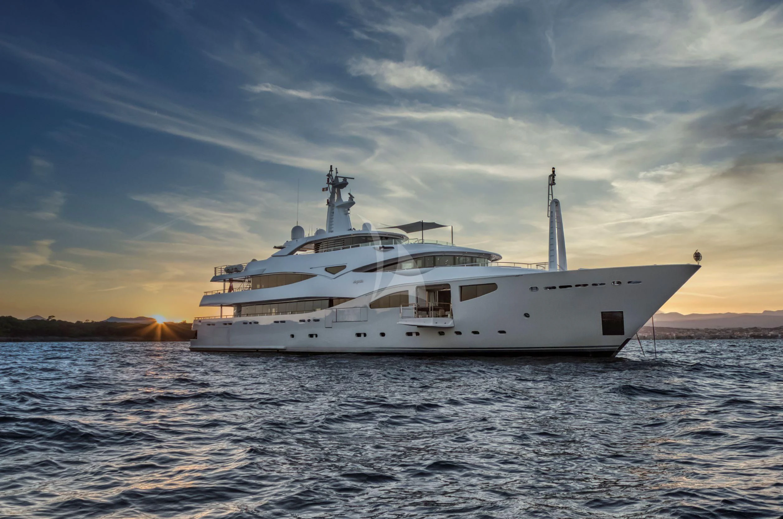 a white boat in the water aboard MARAYA Yacht for Sale