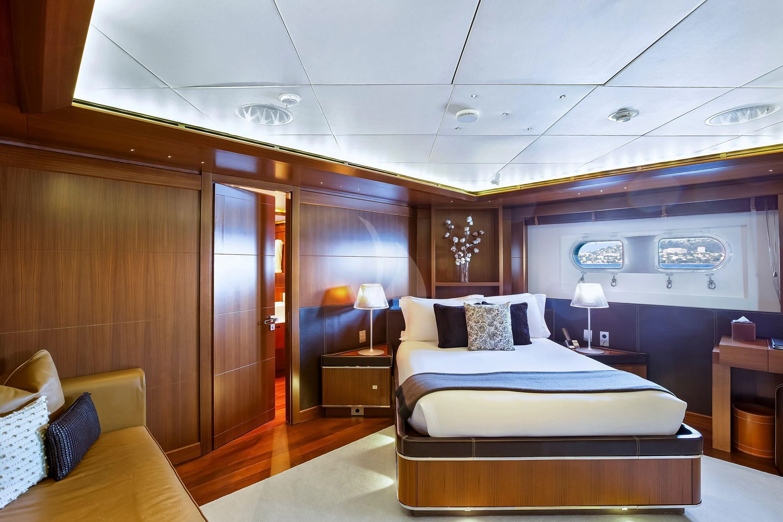 a room with a bed and a couch aboard MARAYA Yacht for Sale