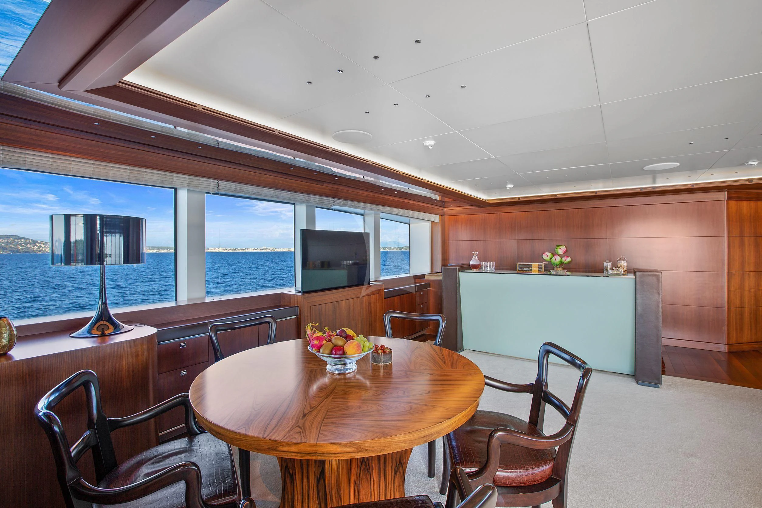 a room with a table and chairs aboard MARAYA Yacht for Sale
