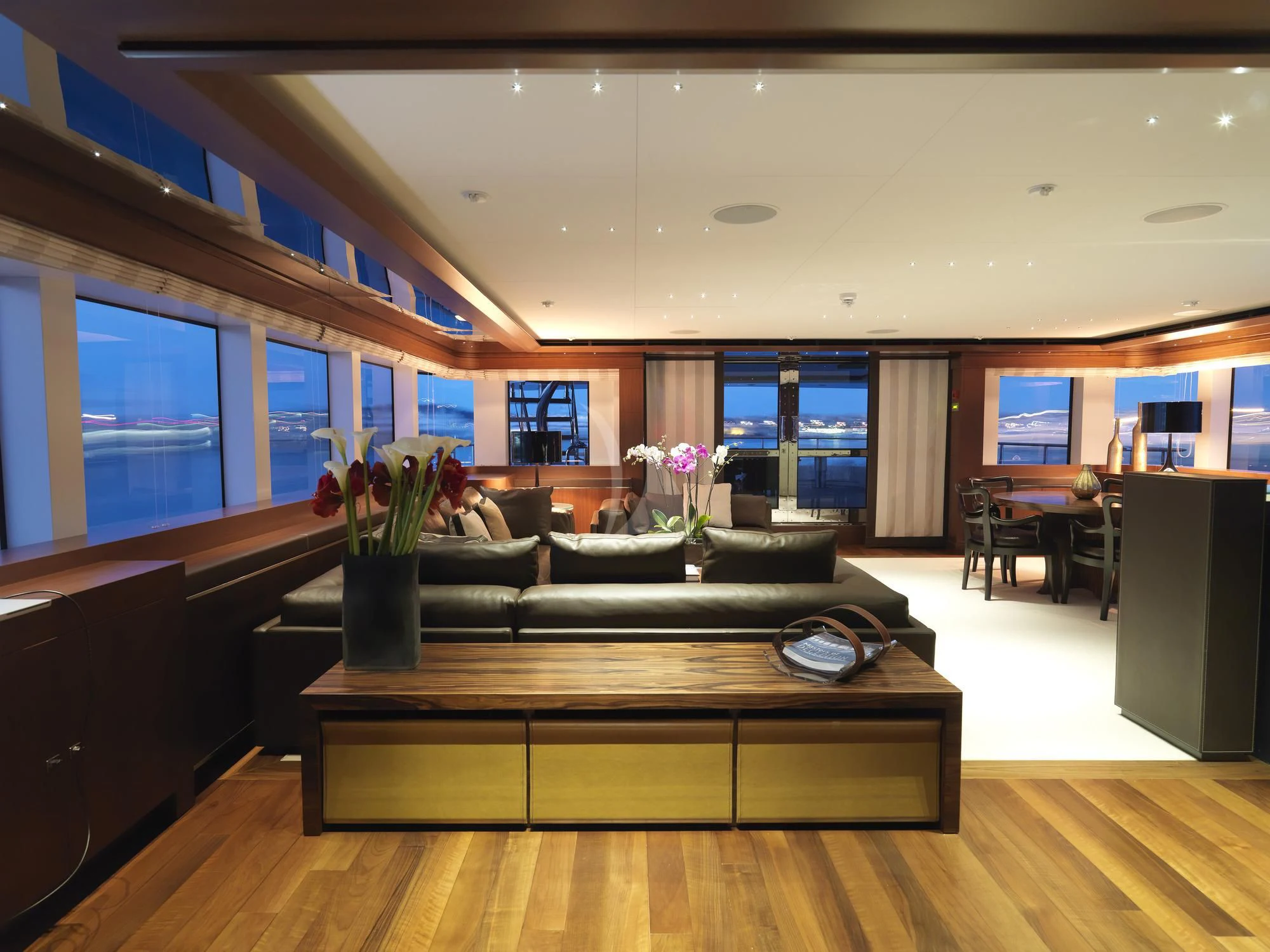 a living room with a leather couch aboard MARAYA Yacht for Sale
