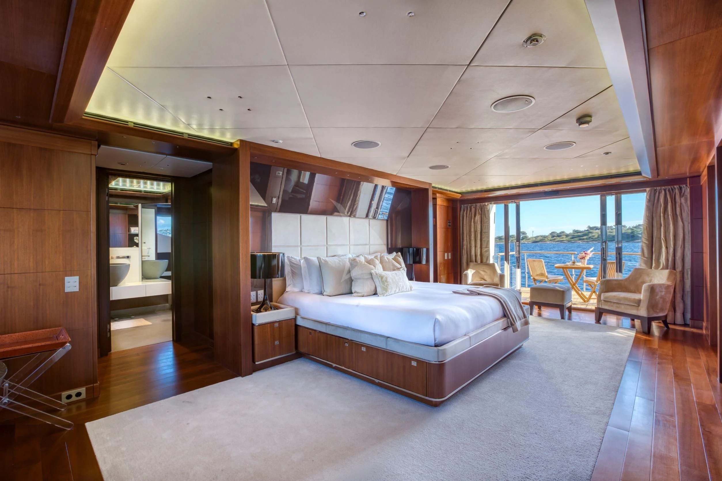 a large bedroom with a large bed aboard MARAYA Yacht for Sale