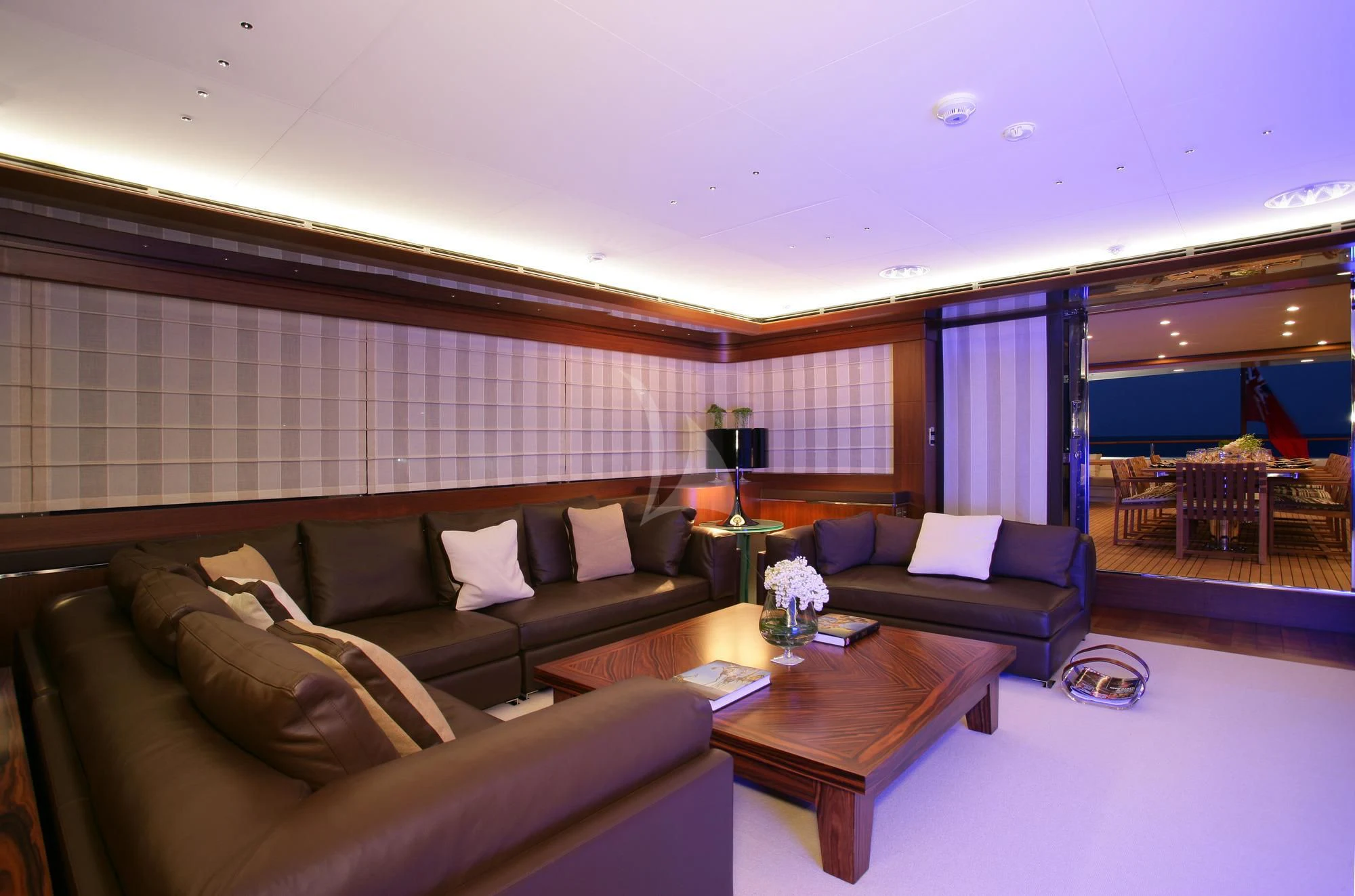 a living room with a couch and a table aboard MARAYA Yacht for Sale