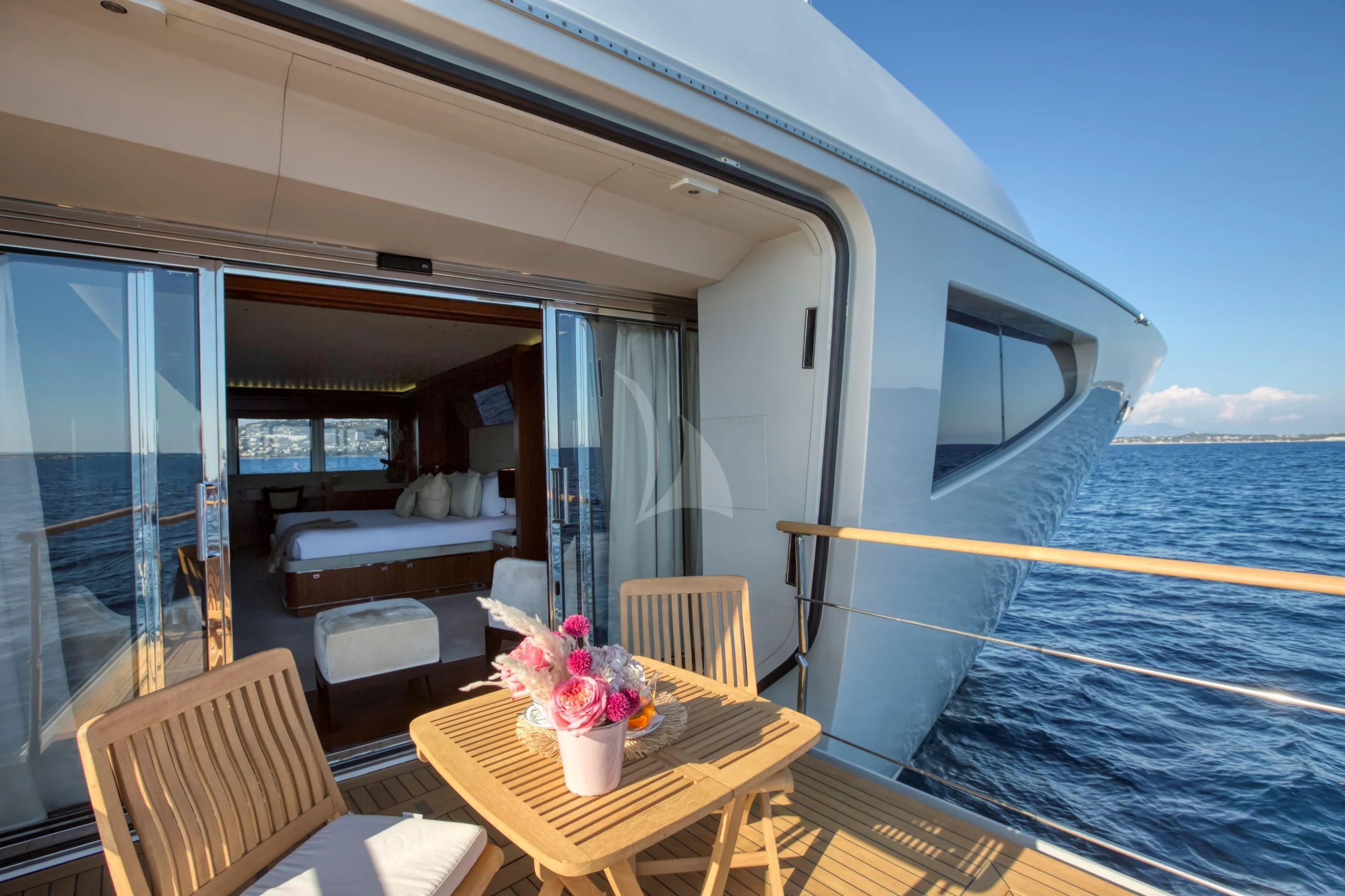 a boat with a table and chairs aboard MARAYA Yacht for Sale