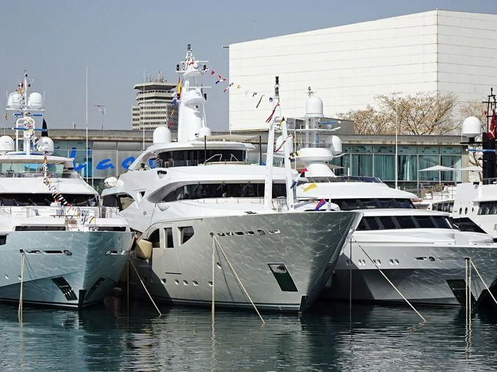 several boats docked in a harbor aboard MARAYA Yacht for Sale