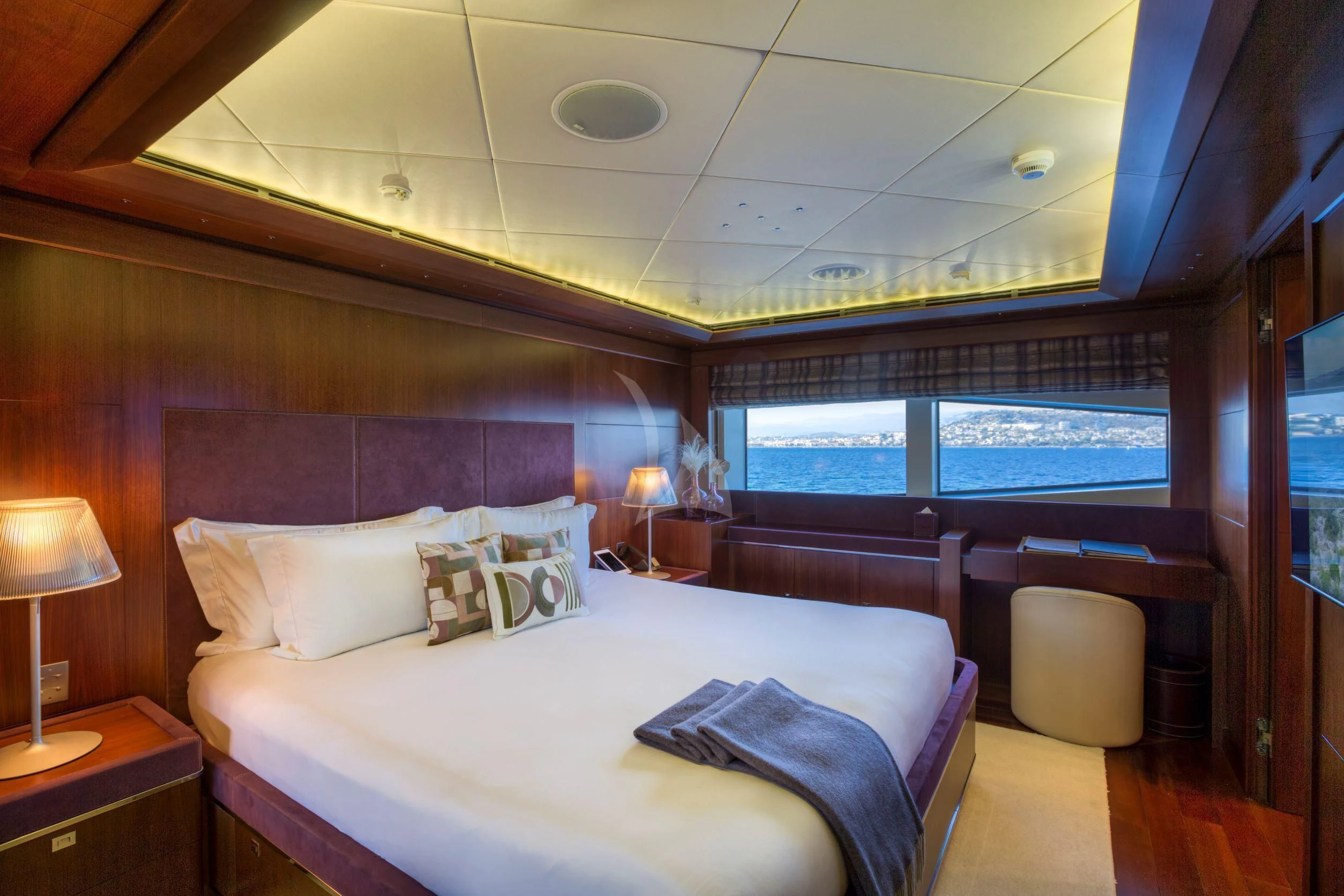 a room with a bed and a large window aboard MARAYA Yacht for Sale