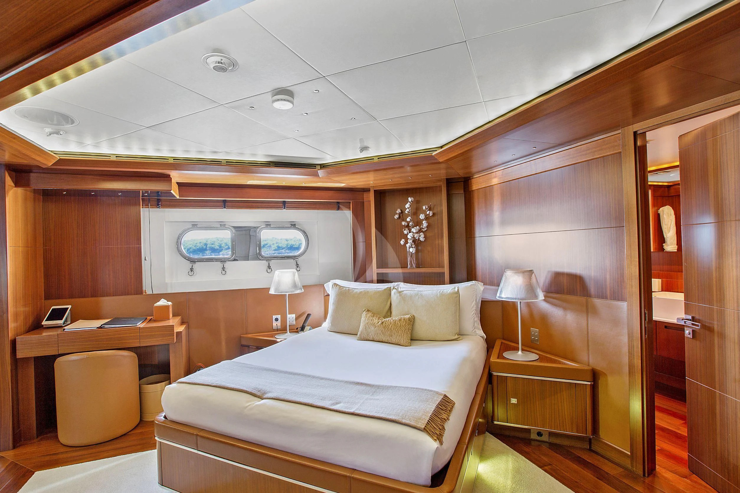 a room with a bed and a desk aboard MARAYA Yacht for Sale